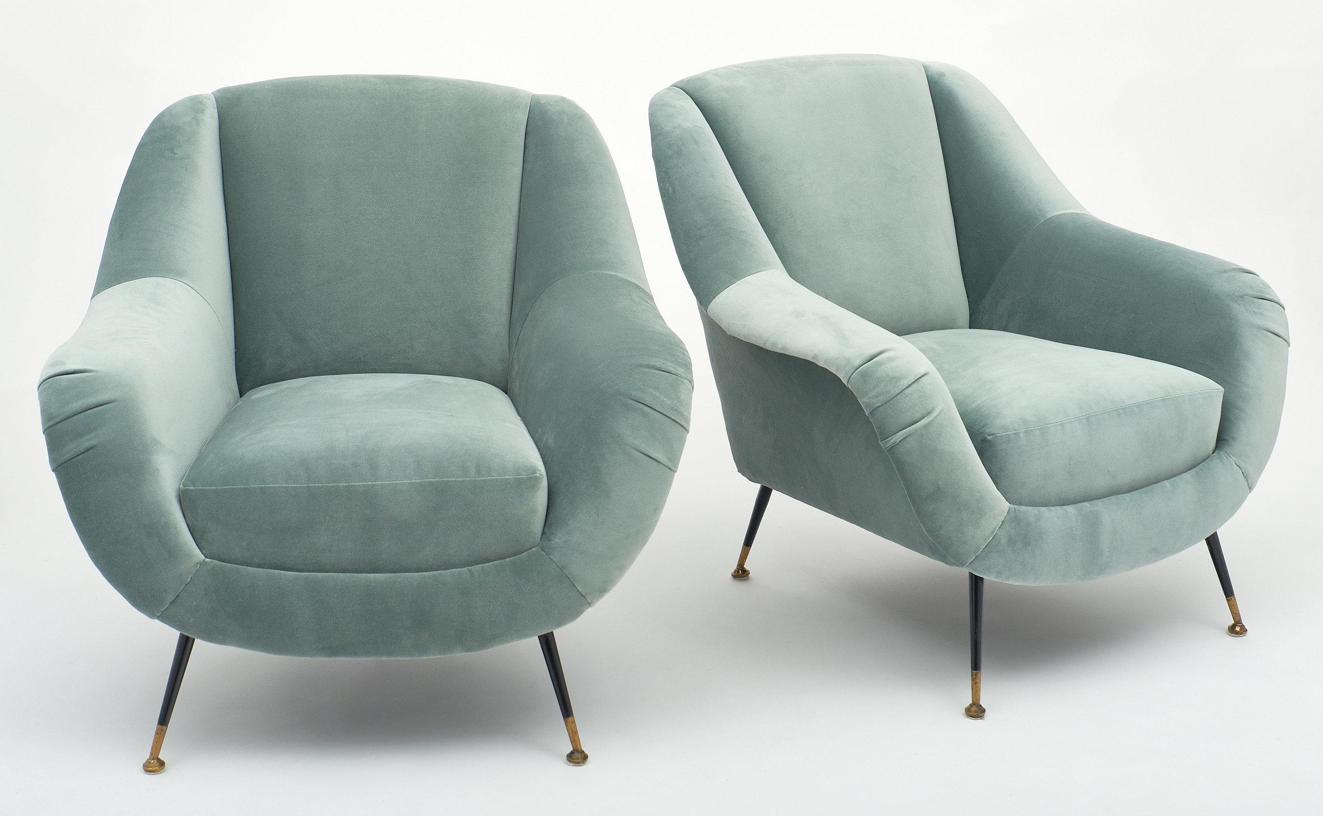 Pair of midcentury armchairs in the style of Carlo di Carli with newly upholstered aqua velvet-cotton blend upholstery. We love the lacquered legs and brass feet. The curved forms are comfortable and striking!