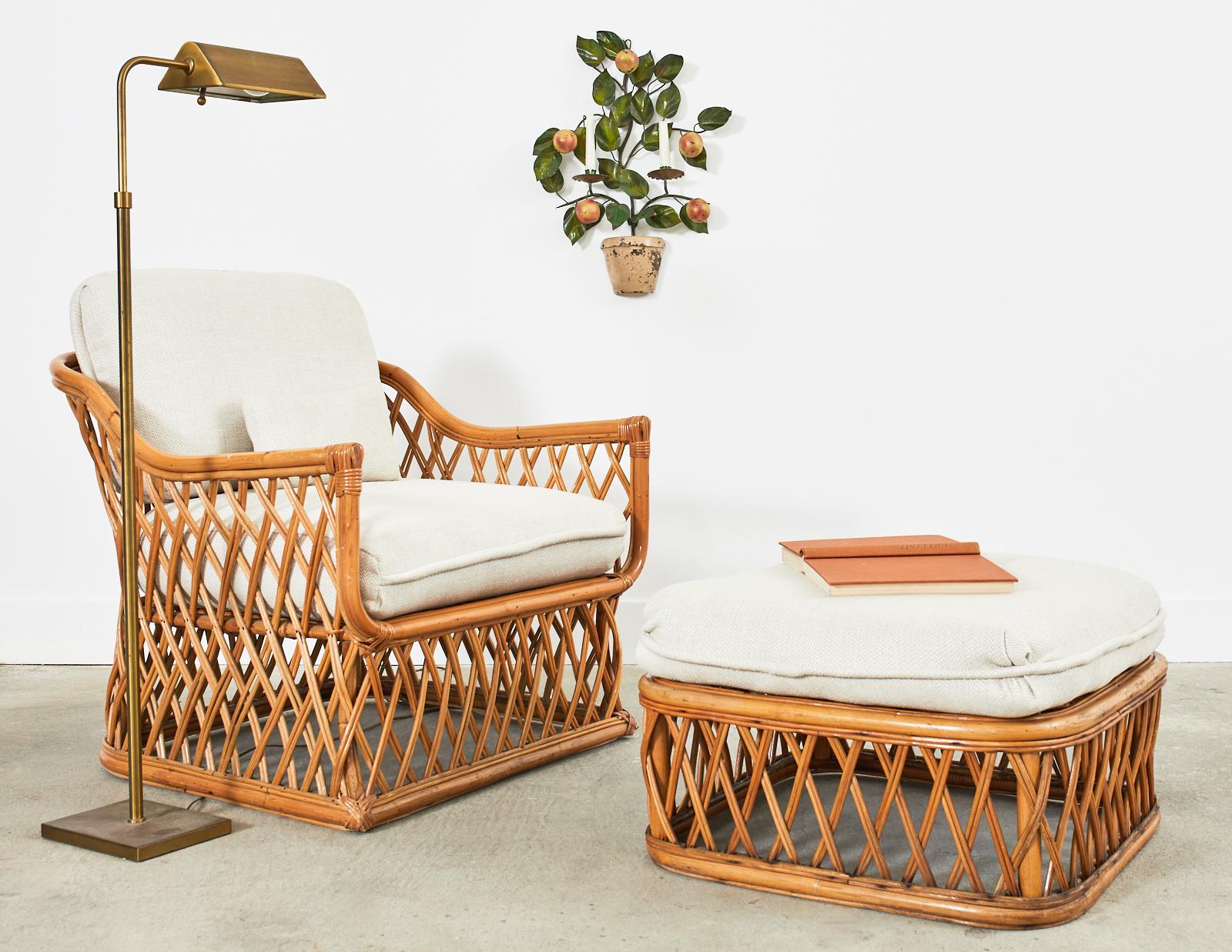 Attractive mid-century Italian organic modern lounge chair and matching ottoman. The lounge chair features a bamboo frame with geometric woven lattice sides and back constructed from pencil reed rattan. The barrel form back gracefully curves down to
