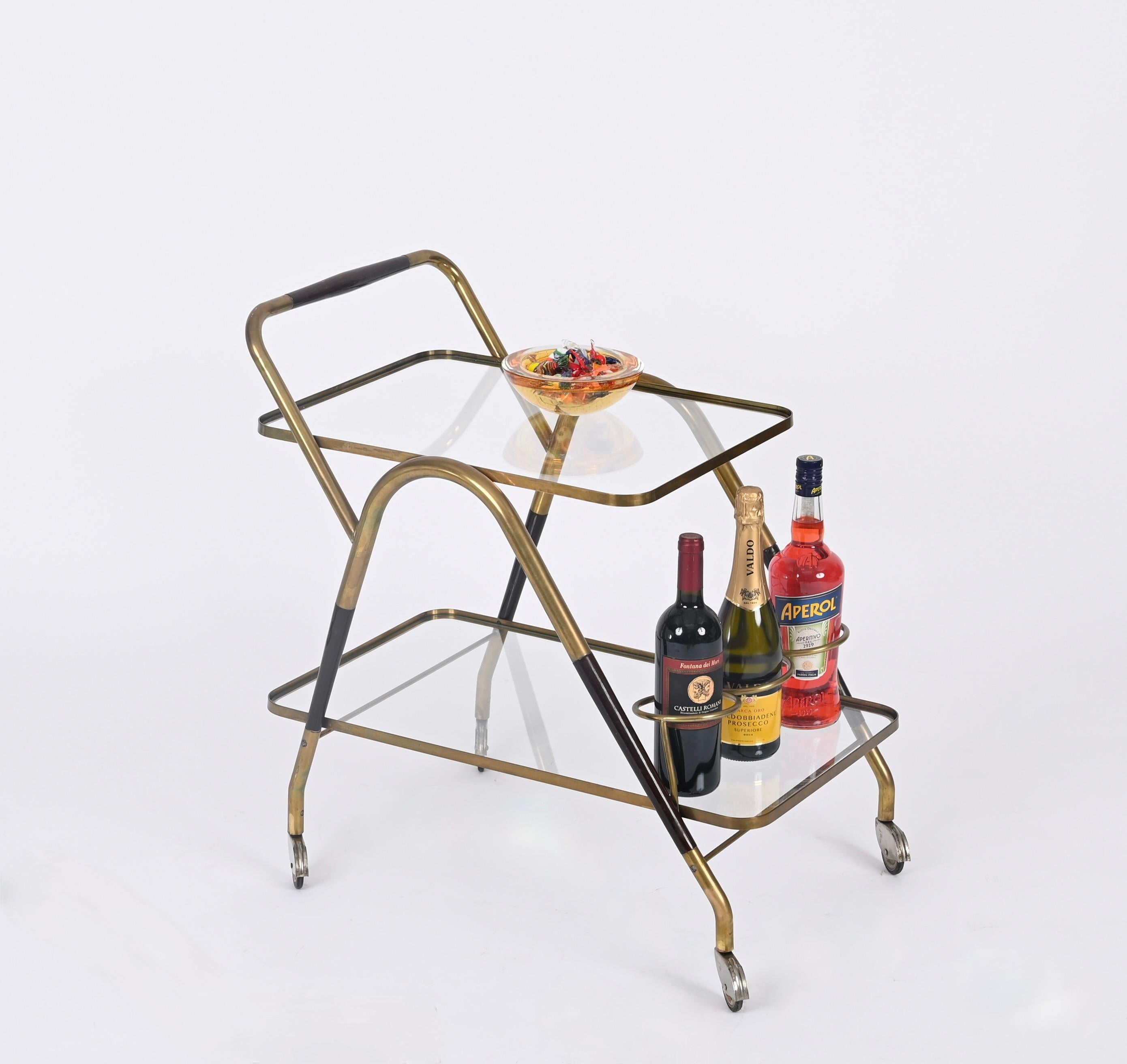 Marvellous Italian serving bar cart in brass and lacqured walnut.  This stunning piece was designed by Cesare Lacca in the 1950s in Italy. 

This stunning cart is in its fully original configuration and in amazing conditions. The sinuous lines of