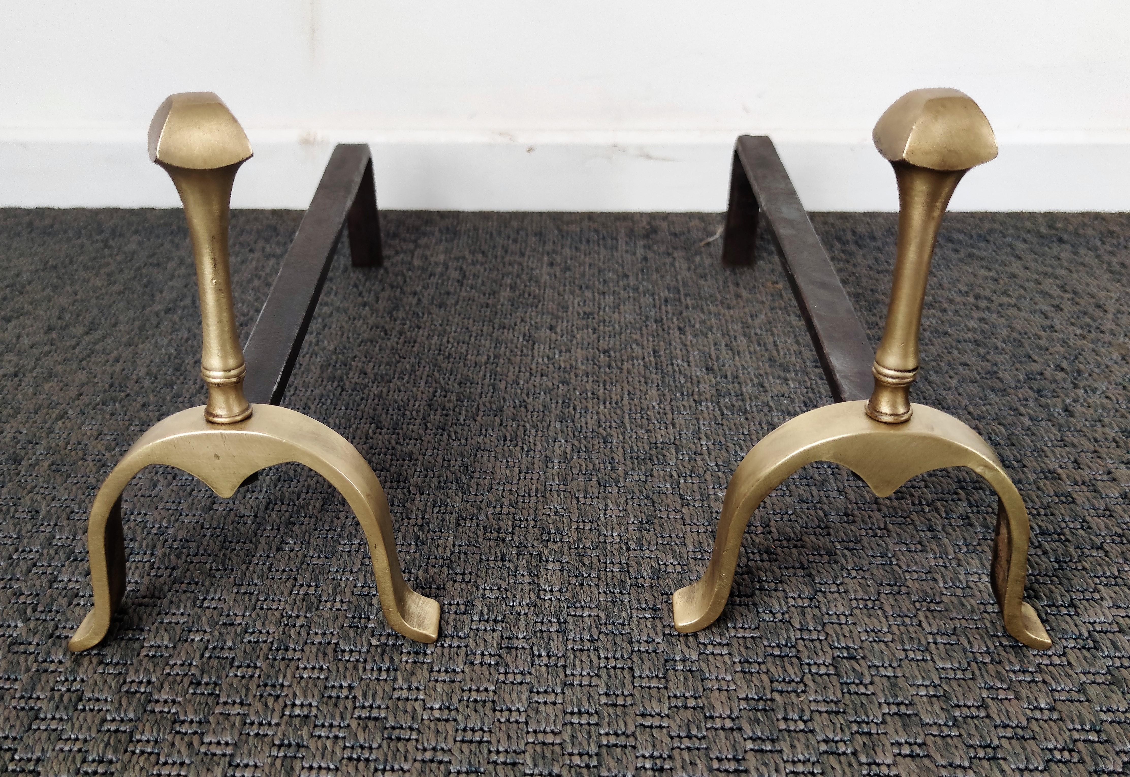Mid-century wrought iron and brass Italian andirons, having a brass front and finial and the usual back in wrought-iron pillars. We have available the matching set of tools as well as wood log holder as can be seen in pictures.