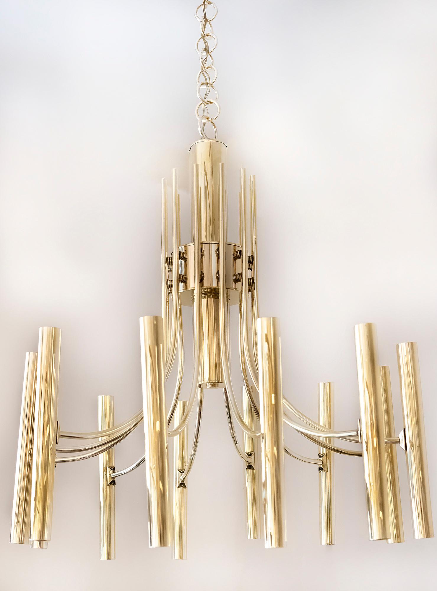 Italian midcentury chandelier is made of brass. This chandelier includes 24 pcs. E14 bulbs that are lighting up and down. The brass is newly polished.

 