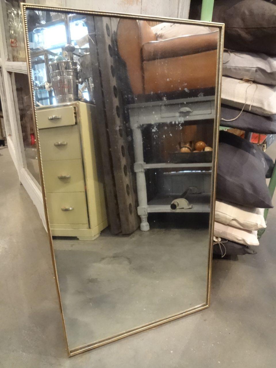 Lovely elegant Italian mirror, with slim brass frame prettily decorated with beading work, 1950s. Sleek and handsome.