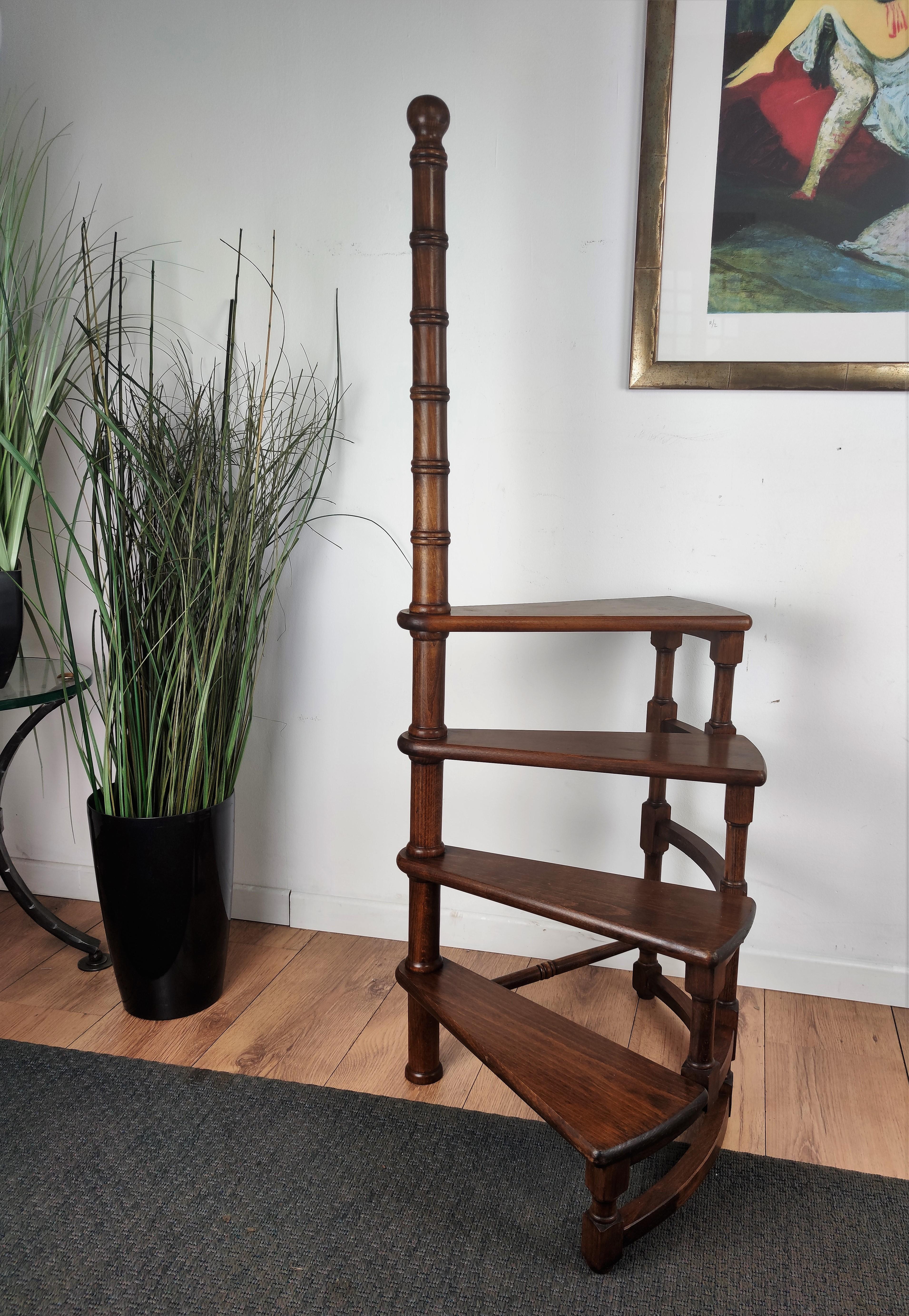 Beautiful Italian carved walnut wood tall circular step ladder with four stairs rolled around a turned, central post embellished with a decorative finial. Versatile and practical, the elegant library essential is in excellent condition with a rich