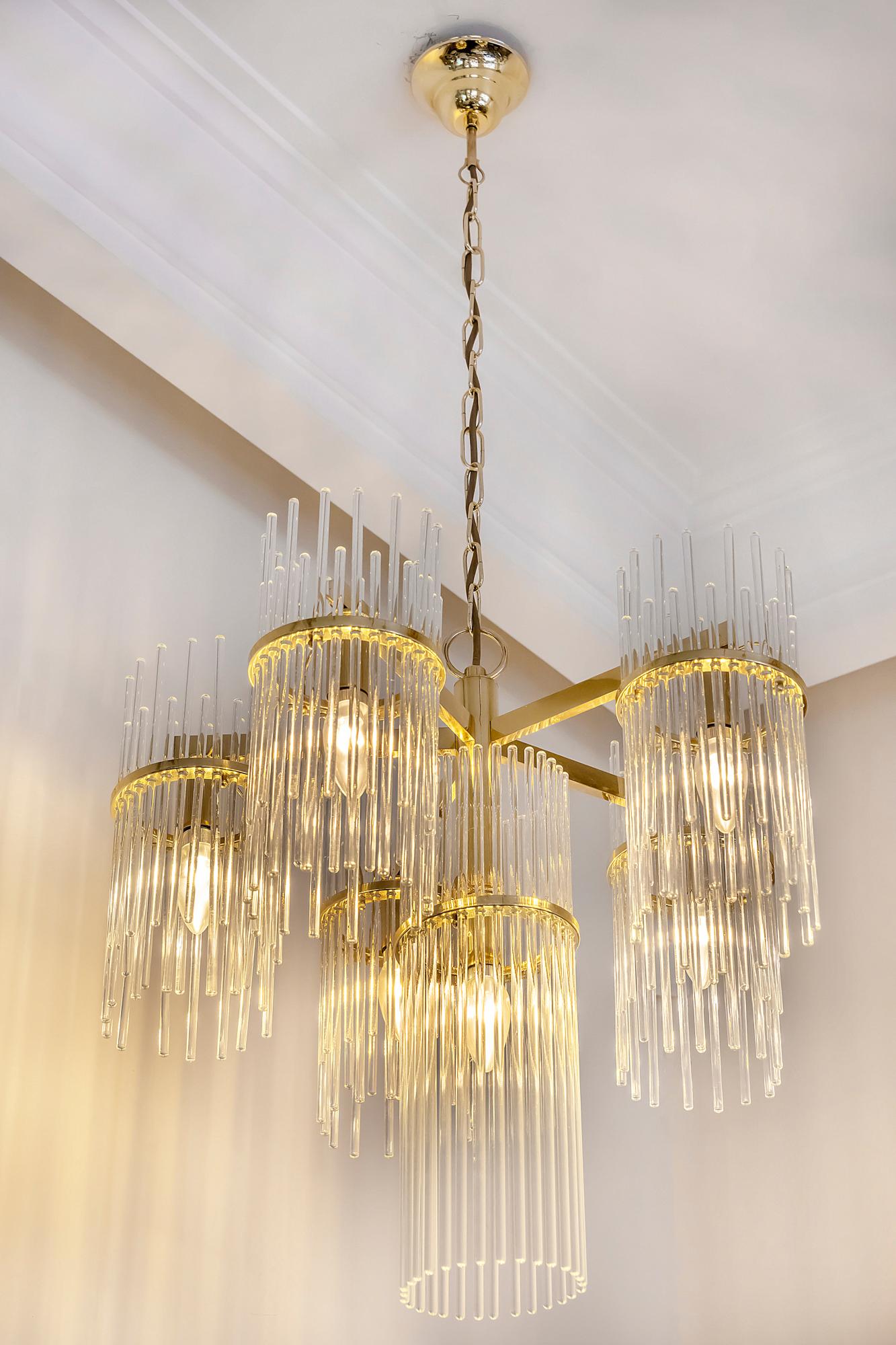 Italian midcentury Sciolari chandelier is made of polished brass and clear glass sticks in the round holders. This chandelier includes 6 pieces. E14 bulbs.
It is in a very good original vintage condition.

 