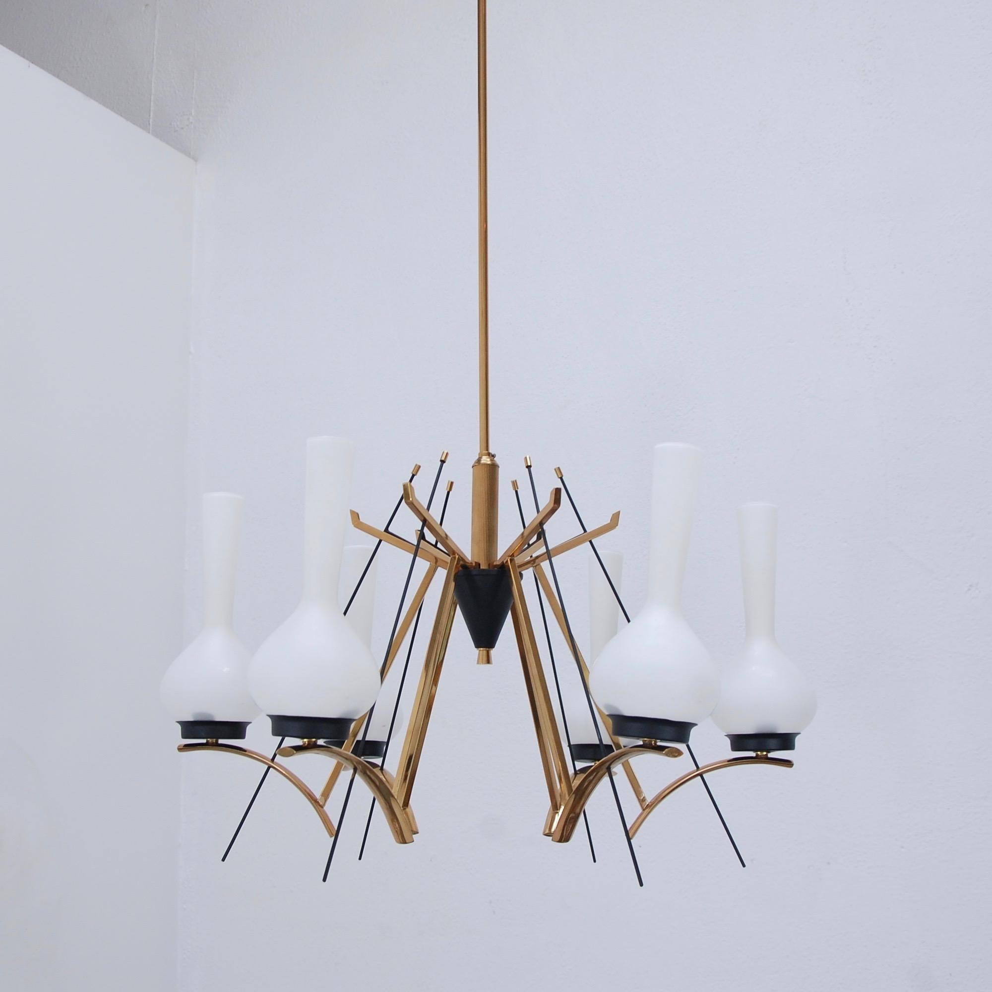 Classic midcentury 6-light chandelier from 1950s, Italy. Naturally added brass patina. Wired for use in the US. Current OAD can be adjusted upon request. (6) Single E12 candelabra based light sockets. Light bulbs included. 
Measurements:
Fixture