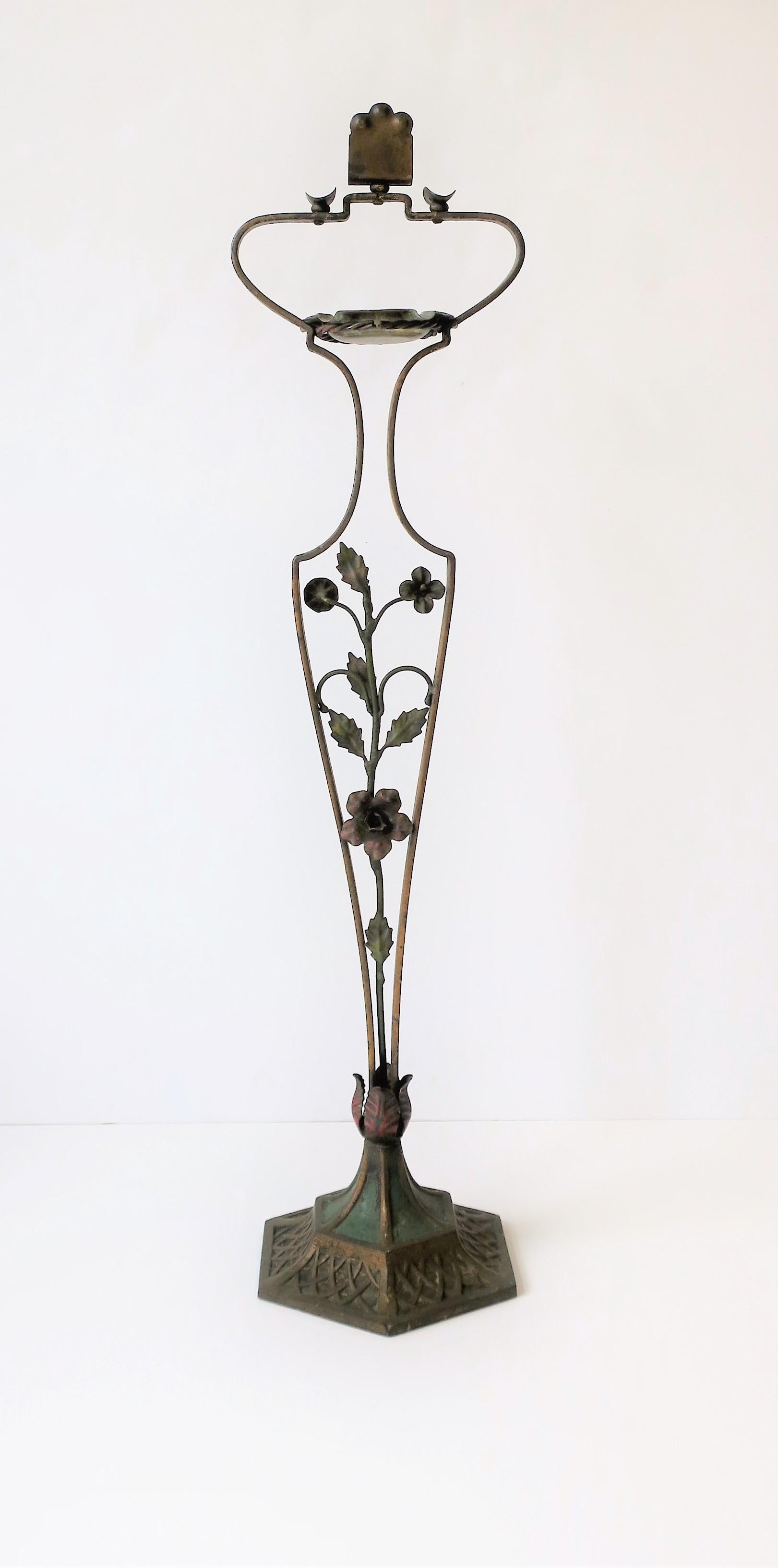 An indoor or outdoor portable patio brass ashtray stand, circa mid-20th century, Italy. Stand has a substantial hexagon base, plant and vine design at center, at top, the ashtray (removable), cigarette or cigar holder/rest area (2), and a matchbook