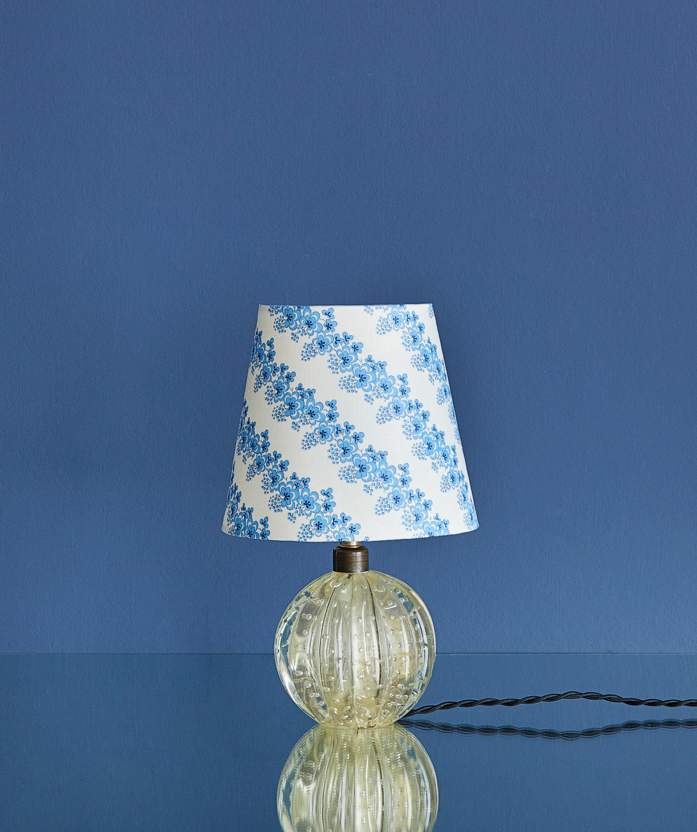 Lovely Murano table lamp in clear glass. New upholstered lamp shade with elegant blue floral pattern.
 
 