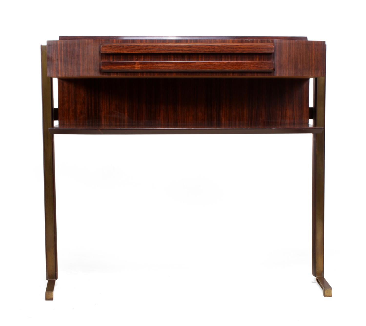 Midcentury Italian console table, circa 1960.
produced in Italy in the 1960s this rosewood and brass console table it has a single central drawer we have cleaned but not polished the brass as we like the patina the top has been polished the overall