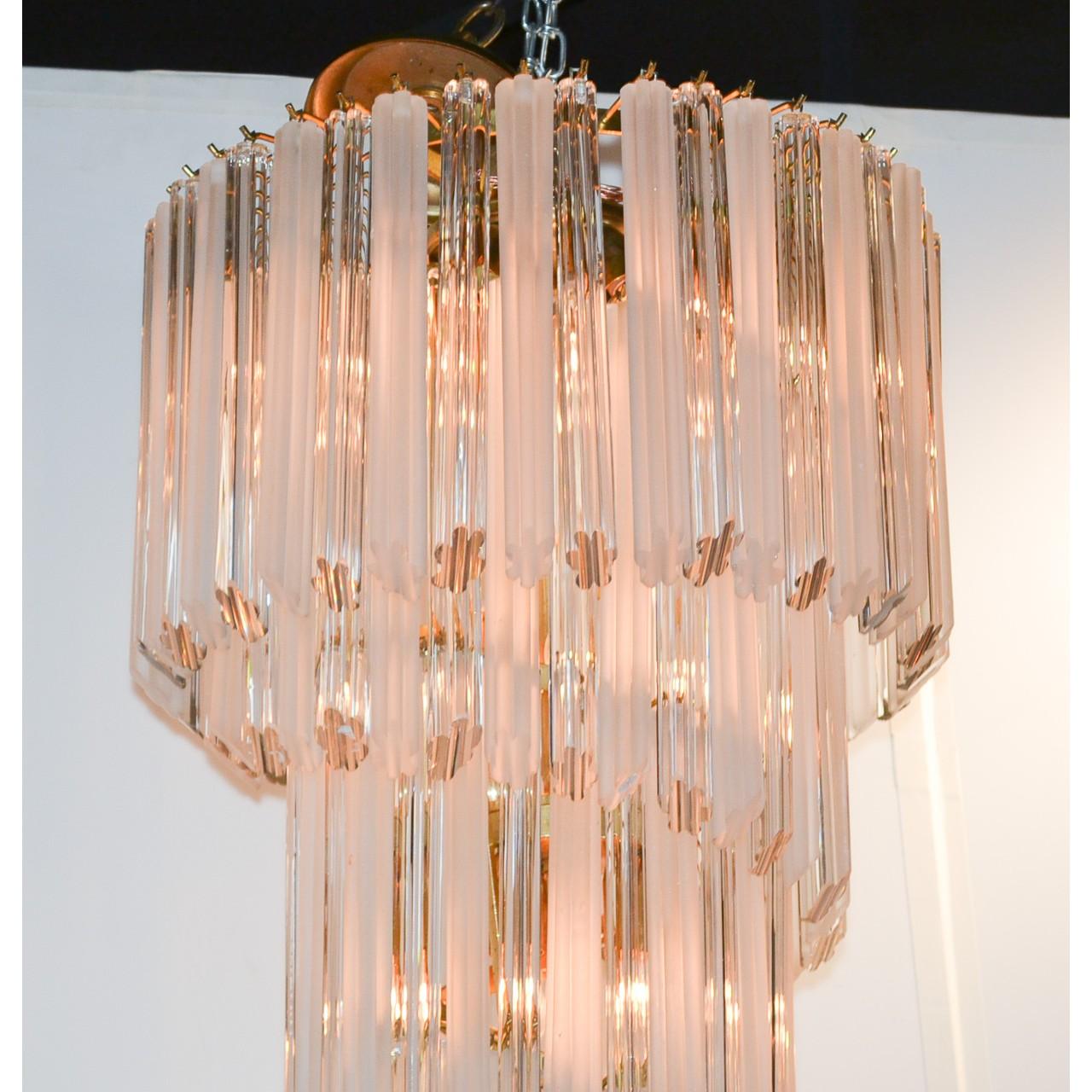 Spectacular mid-century Italian crystal waterfall chandelier with five dramatic cascading tiers of ribbed clear crystal and contrasting frosted crystals. Magnificent light reflection. Definitely a superb statement piece,

circa 1960.