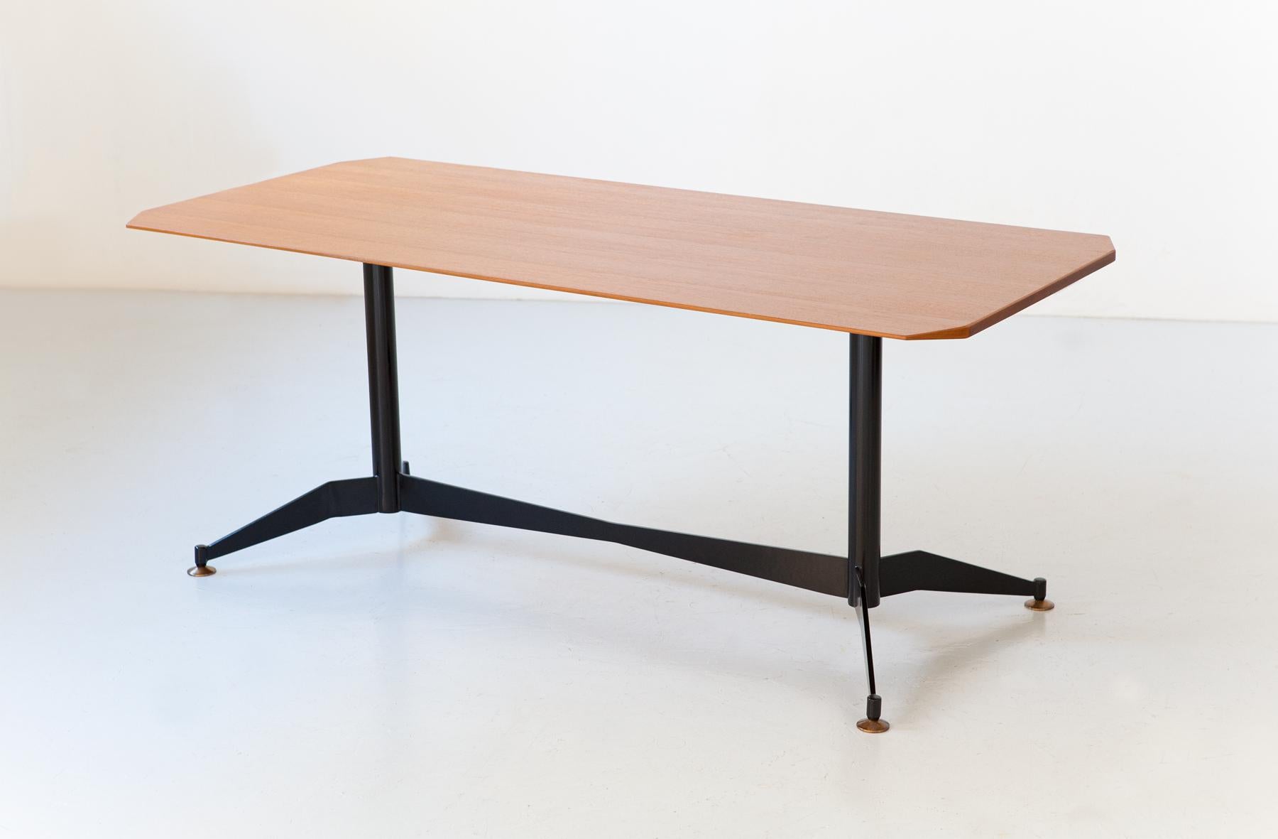 A dining table, manufactured in Italy during the 1950s 

The structure is in black lacquered iron, with a light and ultra modern design, the feet are in brass and adjustable in height. The top is in multilayer wood with teak veneer.

We have
