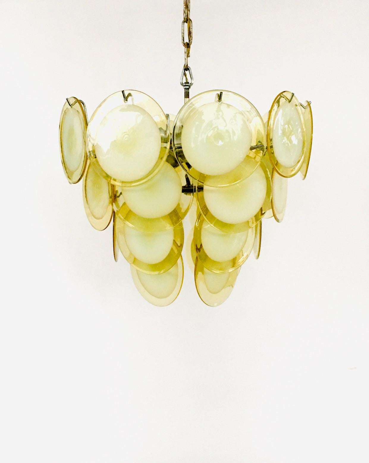 Vintage Midcentury Italian Design Venetian Murano Glass Disc Chandelier by Gino Vistosi for Venini or Mazzega. Made in Italy, Murano, 1960's. Majestic all original classic Murano pendant lamp. Made up of 4 layers with in total 28 amber yellow