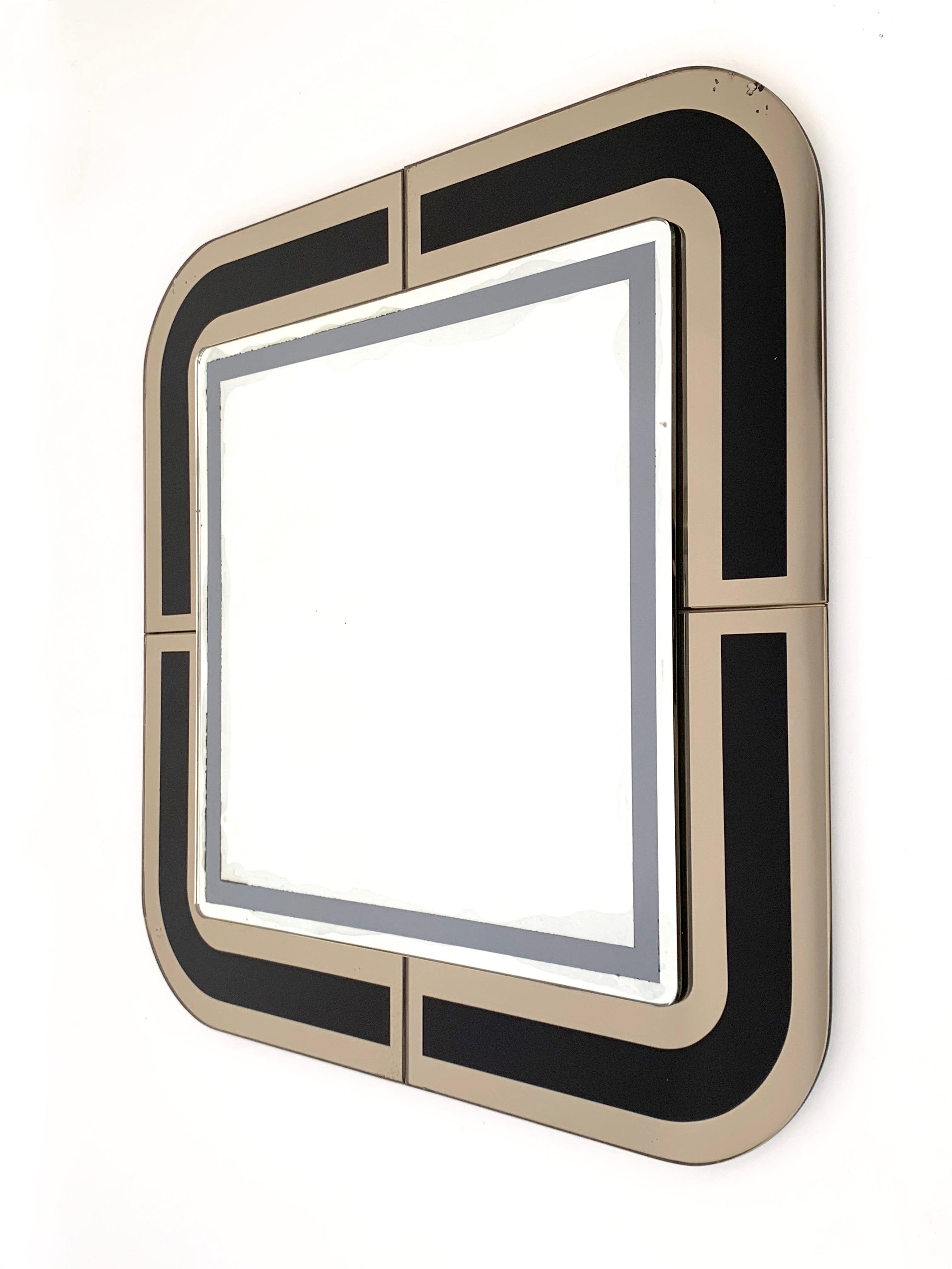 Amazing midcentury square mirror with a double frame. This item was designed in Italy during the 1980s.

The strength of this piece is the double frame: the internal one is in silver and grey (50x50 cm) and the external is in mirrored bronze and