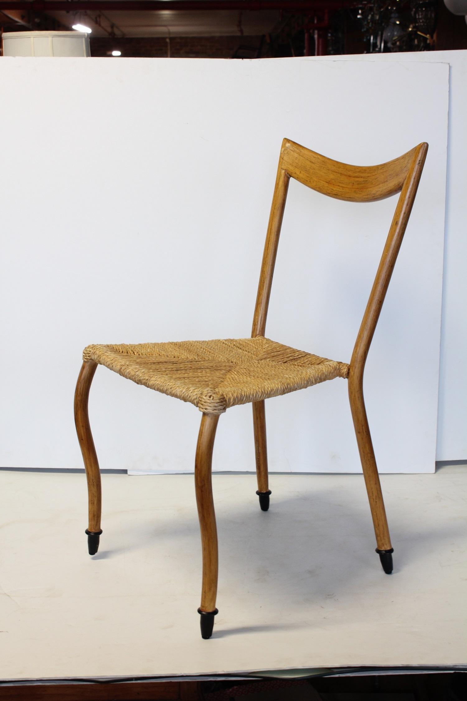 Midcentury Italian Gio Ponti style chair, 2 available. Bentwood chair with woven seat. Listed price is for one chair.