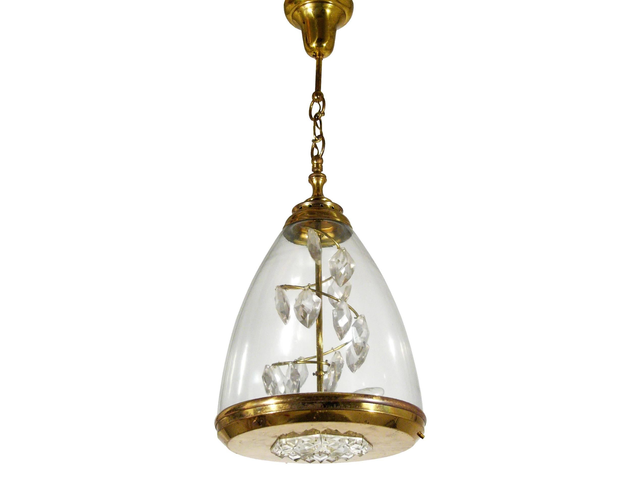 This pendant light was designed in Italy, circa 1950s. Its style resembles the contemporary Azucena production. It is made from brass, mouth blown glass and a decorative spiral of crystal prisms. It remains in excellent vintage condition: Oxidation