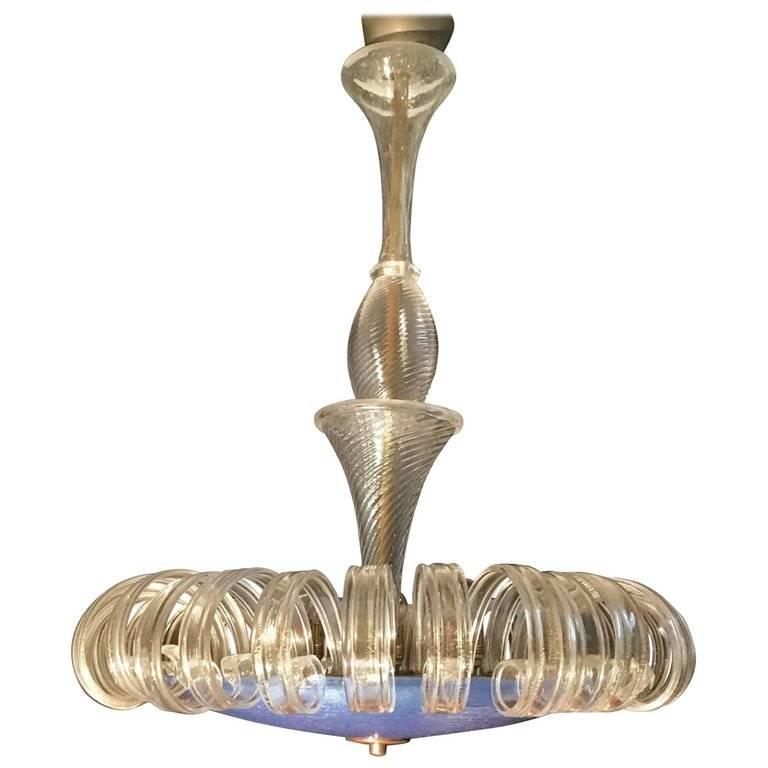 Chandelier of incredible beauty. With a large turquoise plate and curved leaves whit gold inclusions.
