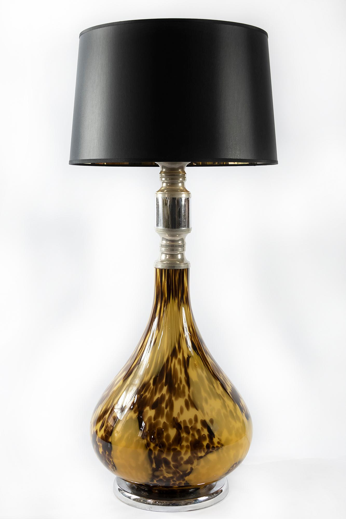 Italian table lamp is made of blowned multicollour glass.
The lamp glass base with inside bulb and it lights together with other bulb.
The base is made of round chrome.
Lamp is with new made satin finish black color textile shade with gold