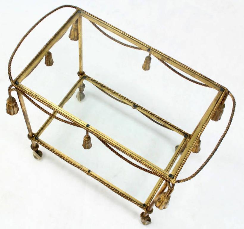 20th Century Midcentury Italian Gold Gilt Metal Rope and Tassels Glass Top Bar Tea Cart Wheel For Sale