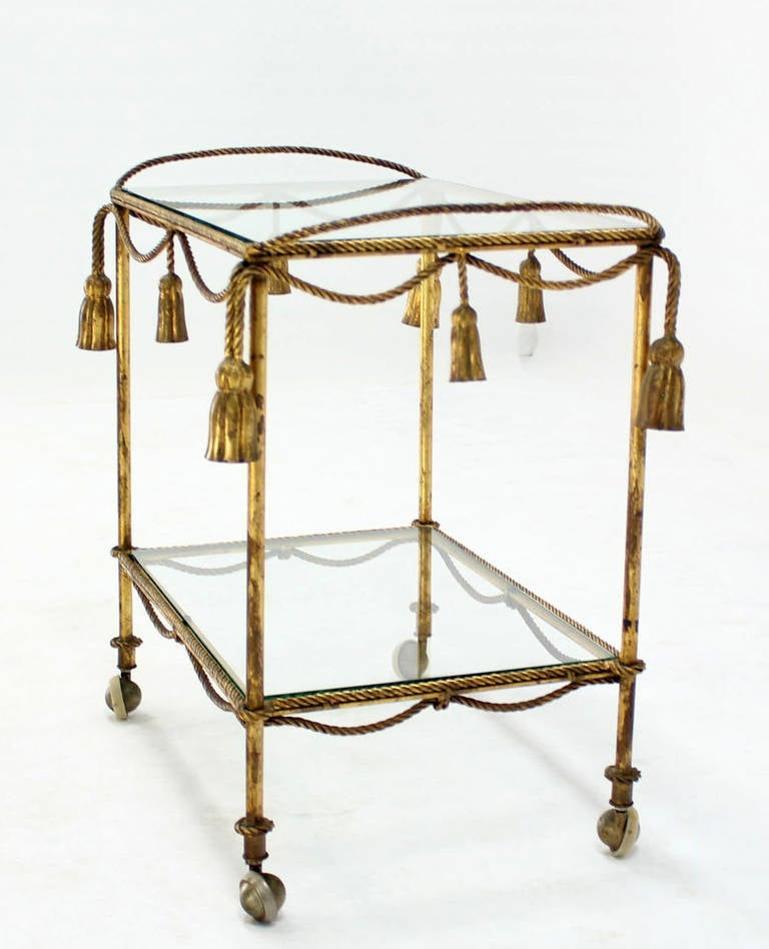 Wrought Iron Midcentury Italian Gold Gilt Metal Rope and Tassels Glass Top Bar Tea Cart Wheel For Sale