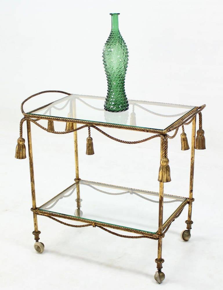 20th Century Midcentury Italian Gold Gilt Metal Rope and Tassels Glass Top Bar Tea Cart Wheel For Sale