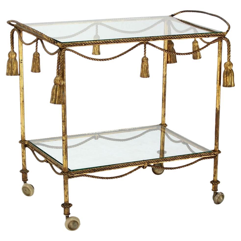 Midcentury Italian Gold Gilt Metal Rope and Tassels Glass Top Bar Tea Cart Wheel For Sale