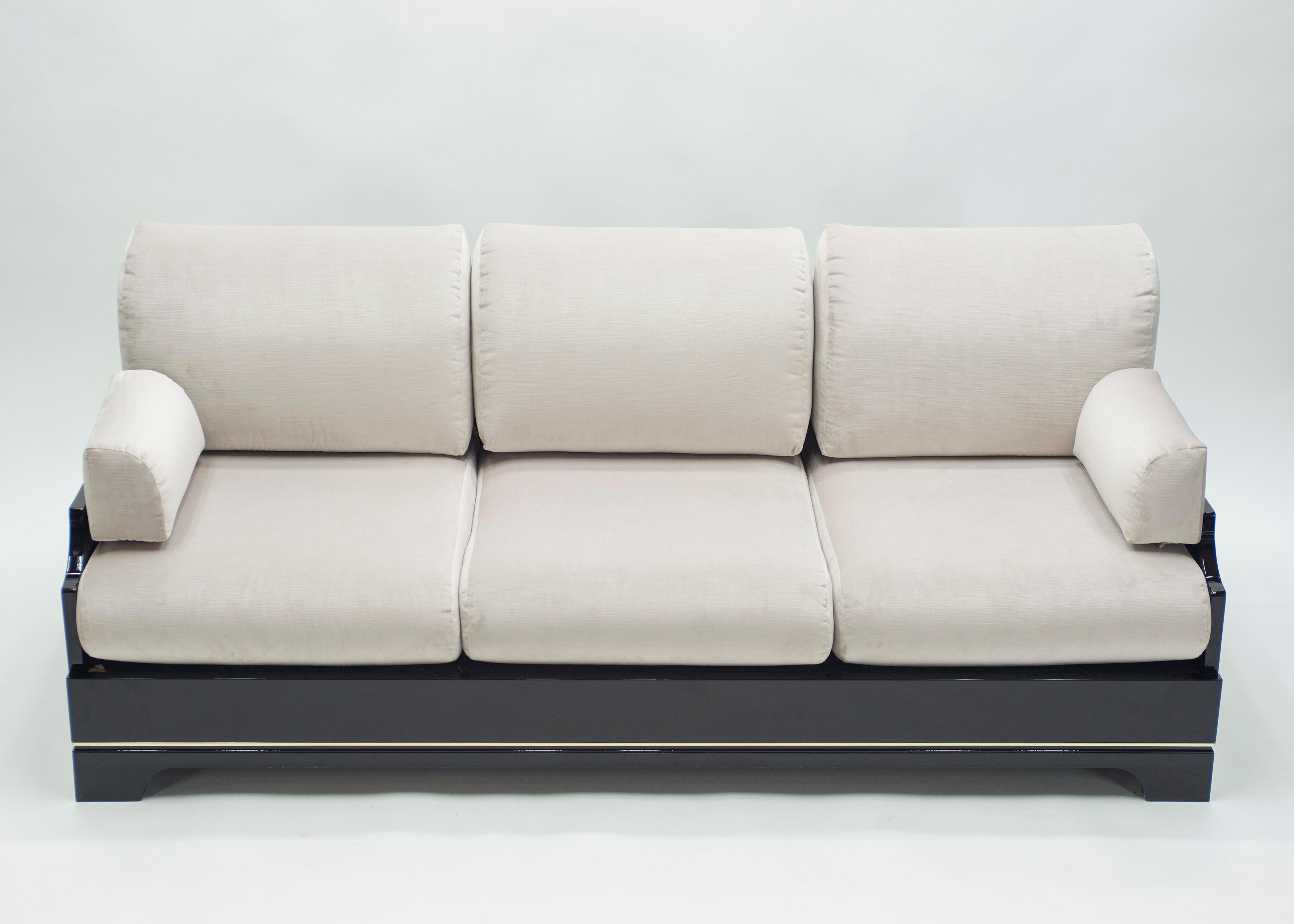 This sofa from the Mid-Century Modern Italian Riviera period designed by Romeo Rega is bursting with nostalgia. With its impeccable design, perfect proportions, and high-end Italian black lacquer and brass materials, it was likely a hugely expensive