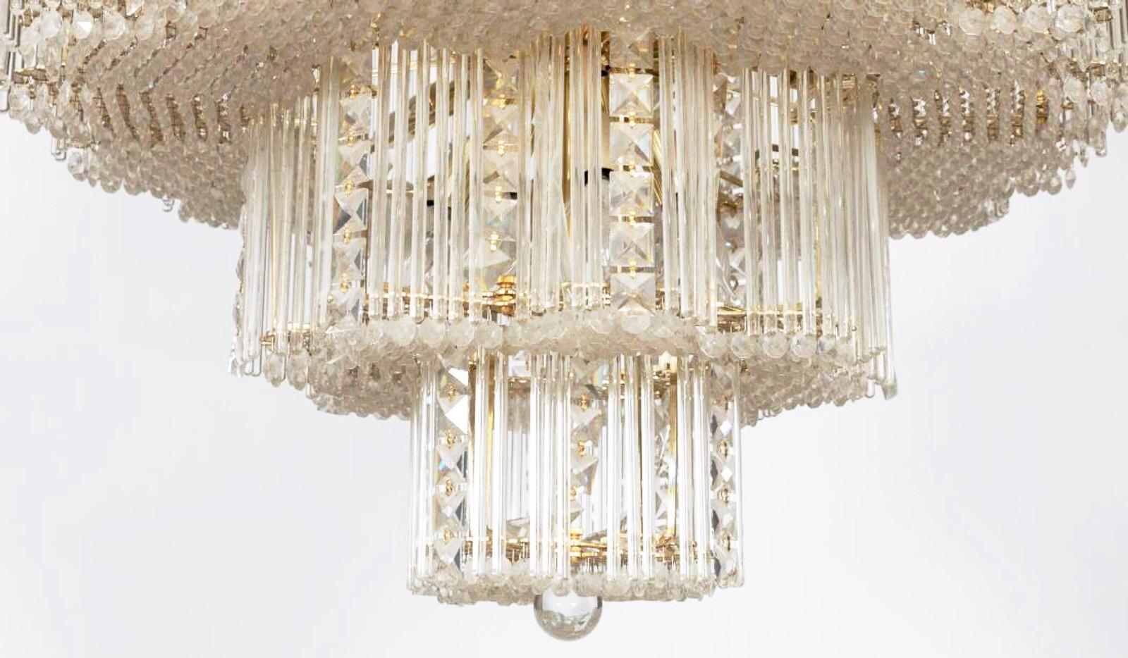 Italian Leaded Glass & Brass Monumental Mid-Century Chandelier, Gaetano Sciolari .  

Stunning Sciolari chandelier with his trademark long crystal hanging rods mounted on brass fixtures interspersed with elegant geometric chains of glimmering French