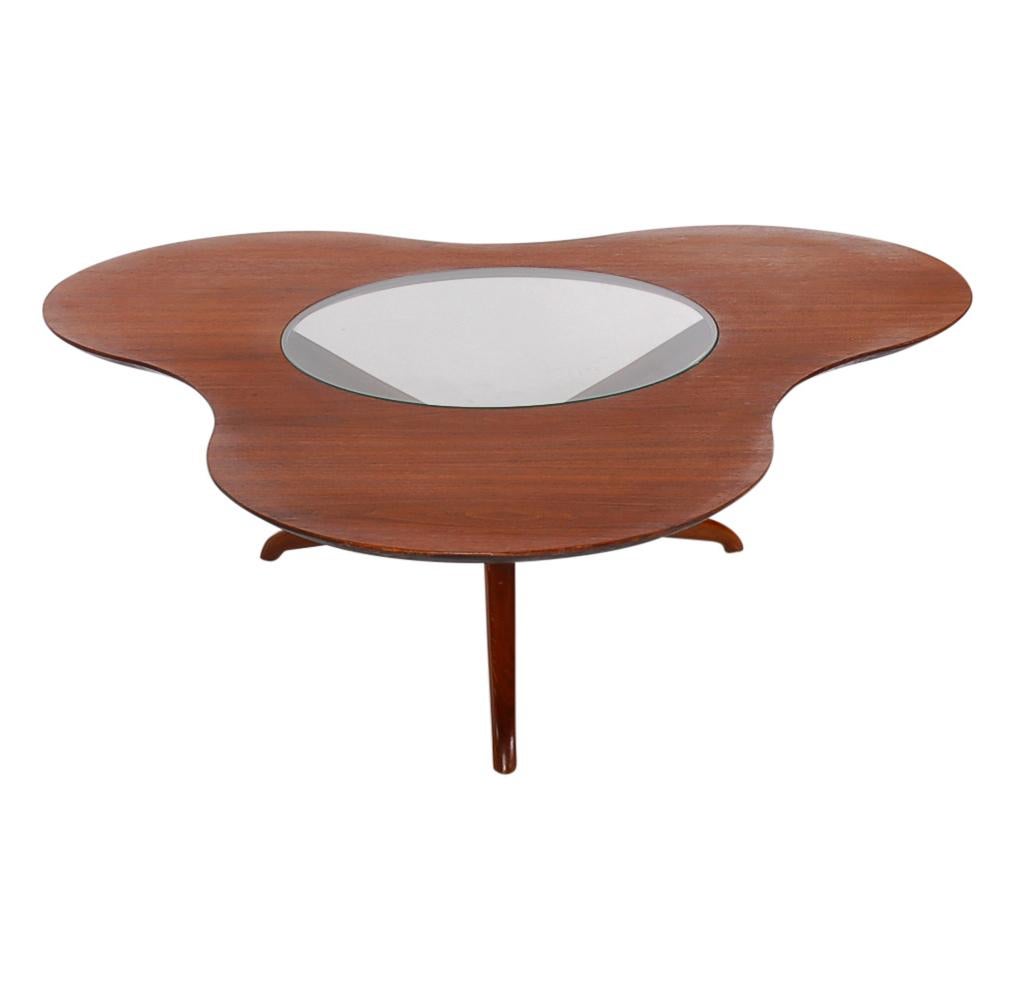An incredible sculptural coffee table designed by Mario Dal Fabbro. It features beautiful walnut construction with inlaid clear glass top. This table is in excellent excellent condition without any damages. 

In the style of: Valadimir kagan and