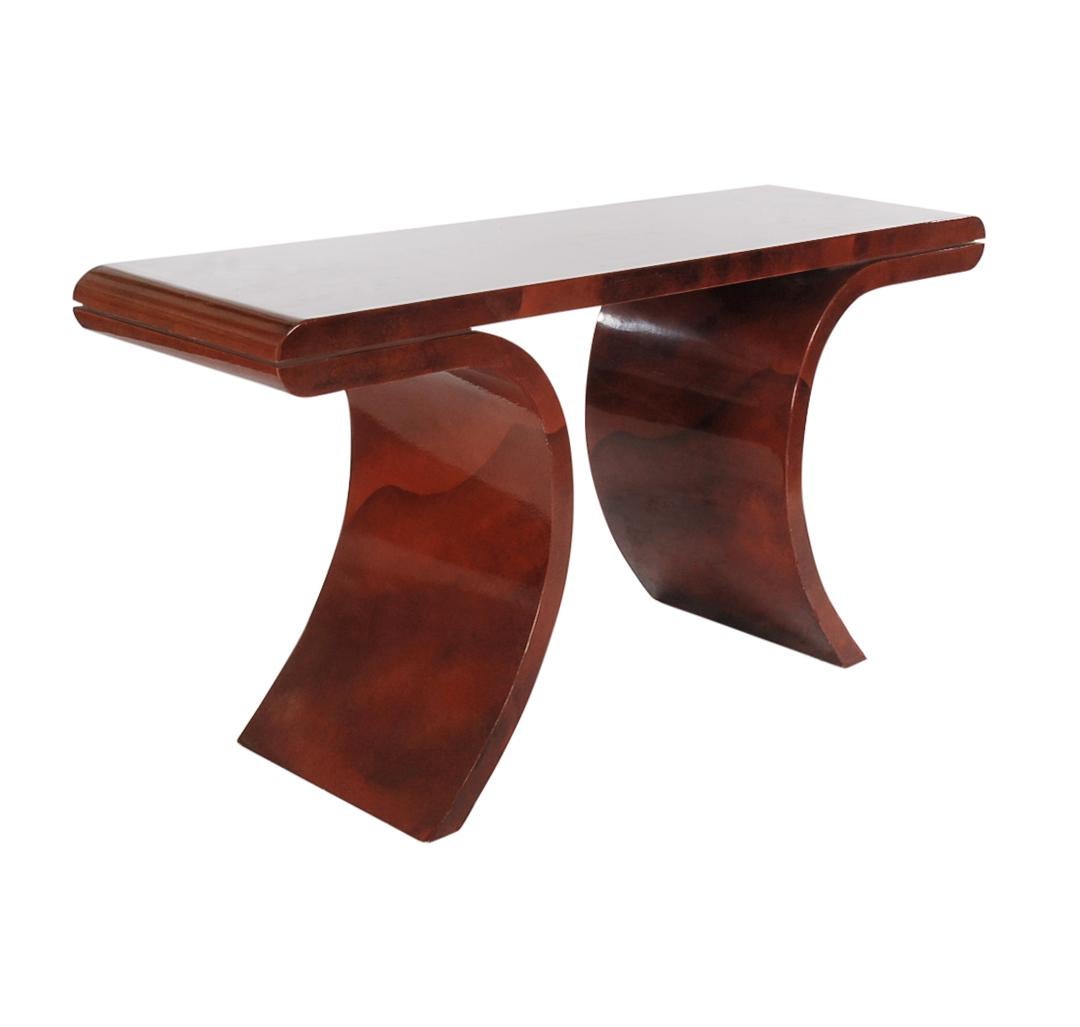 An elegant modern design console made in Italy, circa 1970s. It features wood construction with a marbleized lacquer glaze in gloss finish. Very reminiscent of the work from Aldo Tura. Absolutely stunning.