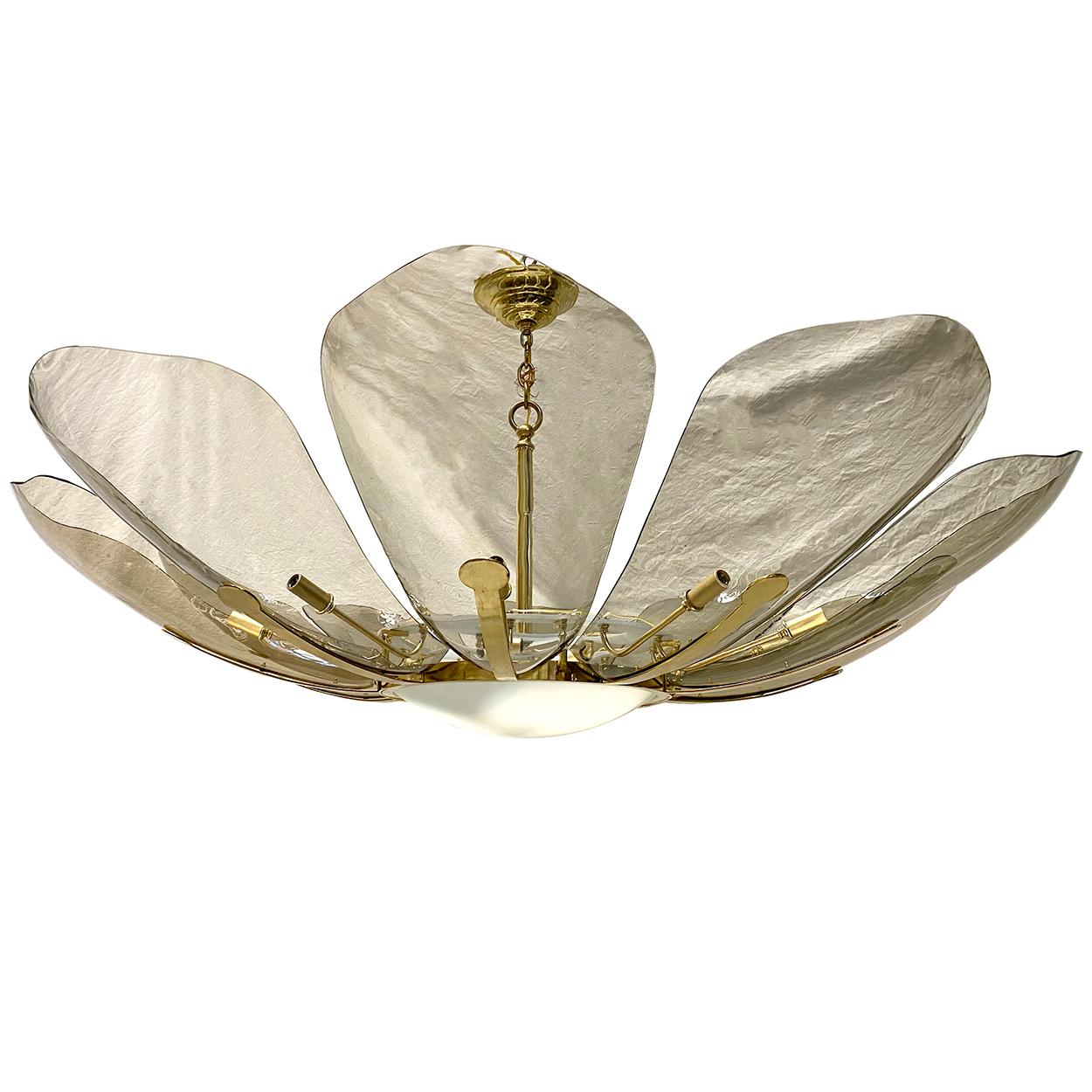 A circa 1960's Italian molded glass light fixture with ten lights on the petals and three in the interior.

Measurements:
Diameter: 56