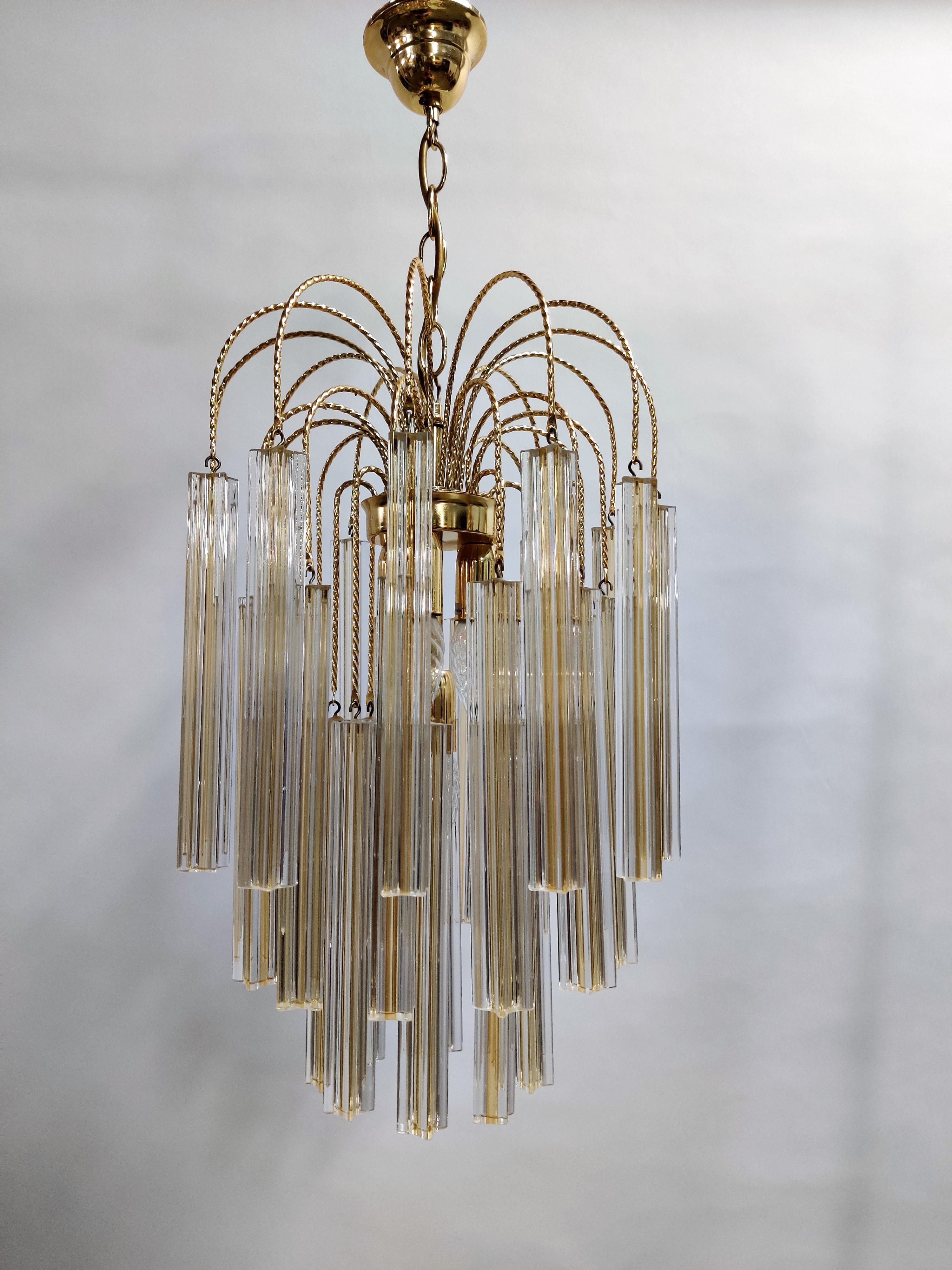 Very beautiful brass chandelier with handmade Murano Venini crystal glass.

The chandelier has multiple lightpoints, creating a beautiful warm light.

Perfect condition, no damages to the glass.

The chandelier has been tested and works with