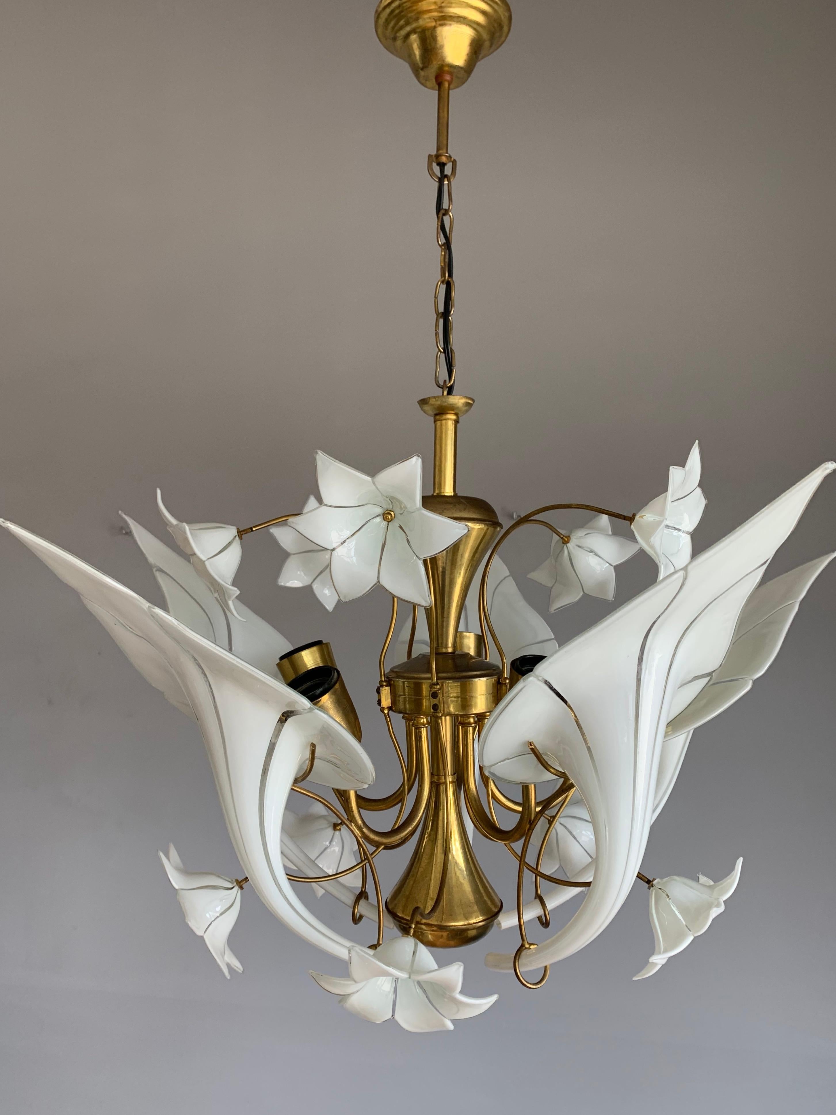 Mouth blown art glass in gilt brass frame, flower bouquet design light fixture.

If you are looking for a striking and extraordinary light fixture to grace your living space then this, Italian work of lighting art could be the one for you. This