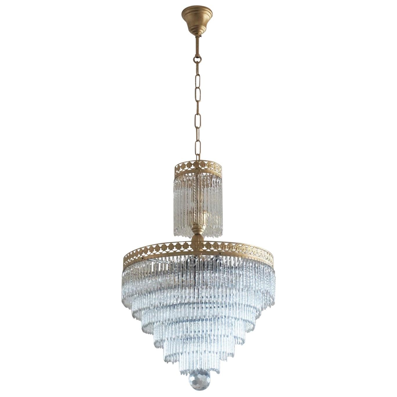 A wonderful brass and crystal waterfall flushmount or chandelier with seven tiers Murano crystal sticks, Italy 1950-1959 - impressive lighting effect!
This chandelier is in very good condition, rewired, all crystal sticks cleaned to its original