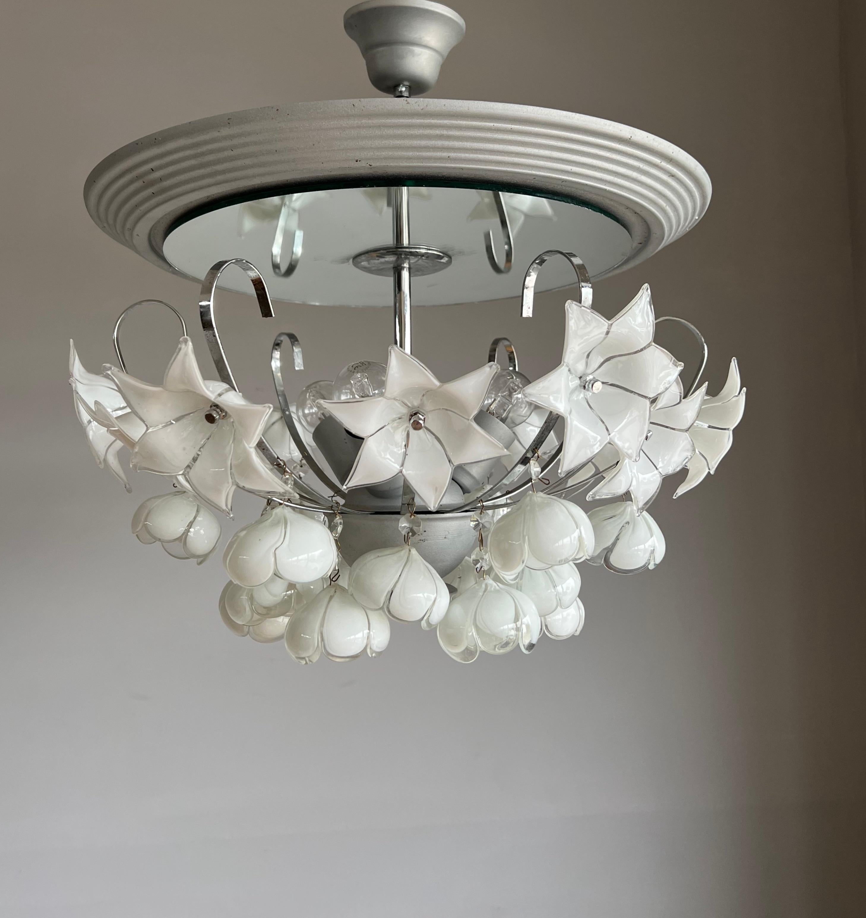 Mouth blown white glass flower bouquet light fixture with integrated ceiling mirror.

If you are looking for a striking and extraordinary light fixture to grace your living space then this, Italian work of lighting art could be the one for you. This