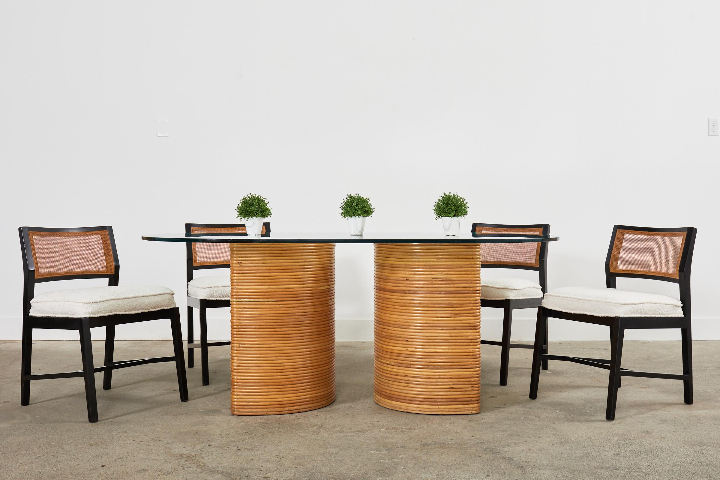 Fantastic Mid-Century Modern Italian double pedestal dining table crafted from split reed rattan. The organic modern design features are demilune or 