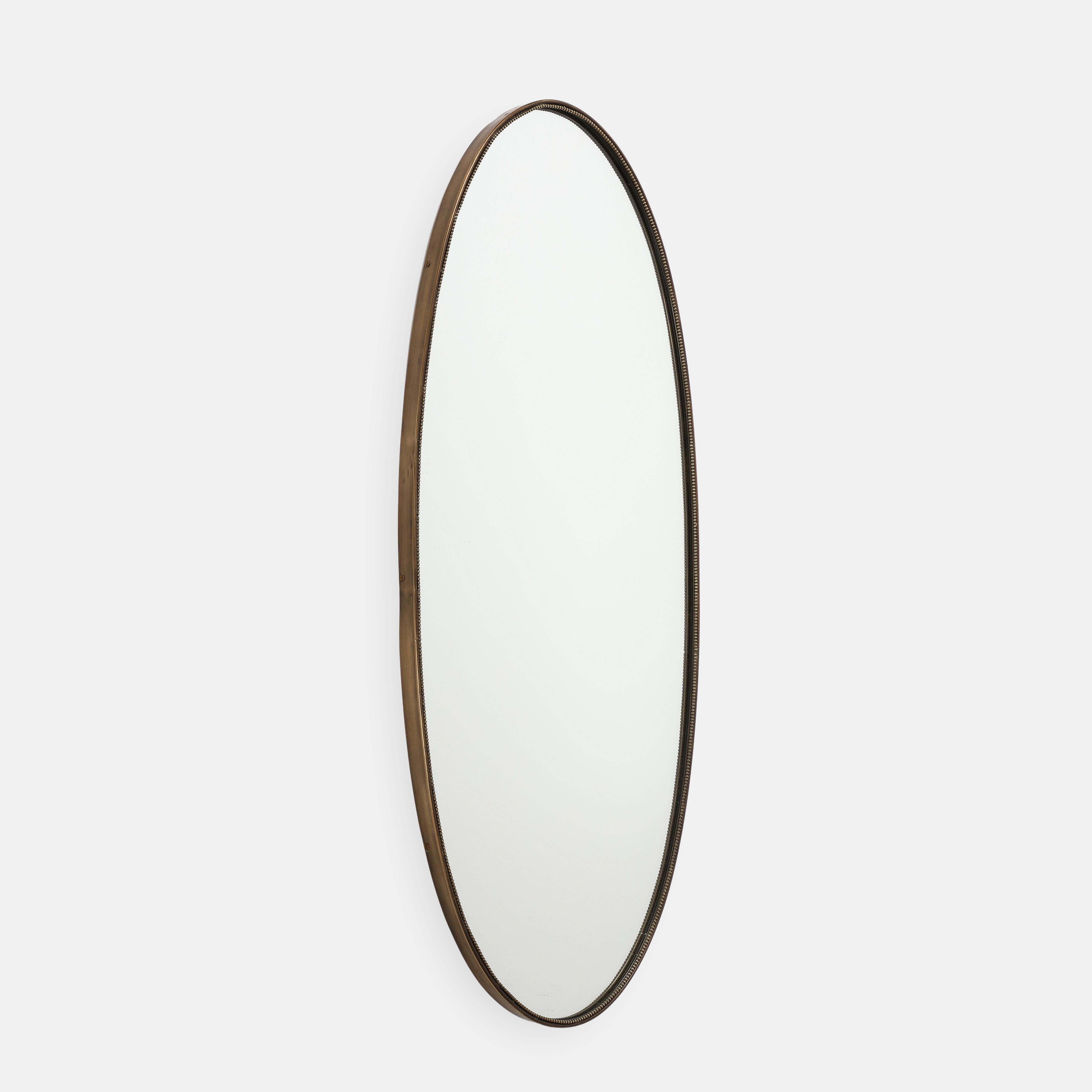 Midcentury Italian classic oval wall mirror with elegant beaded brass trim frame, 1950s