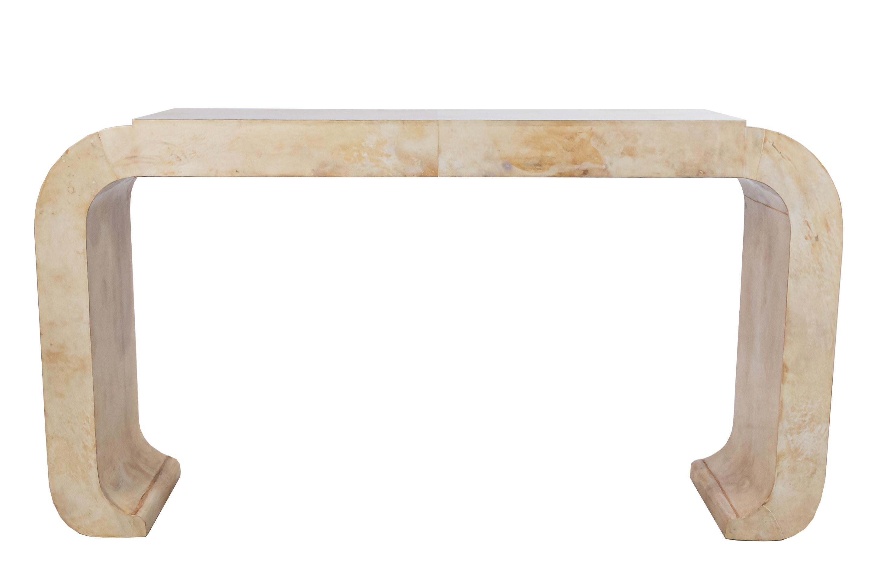 Midcentury Italian (circa 1970) parchment veneer console table with rounded edges and a raised center section.
