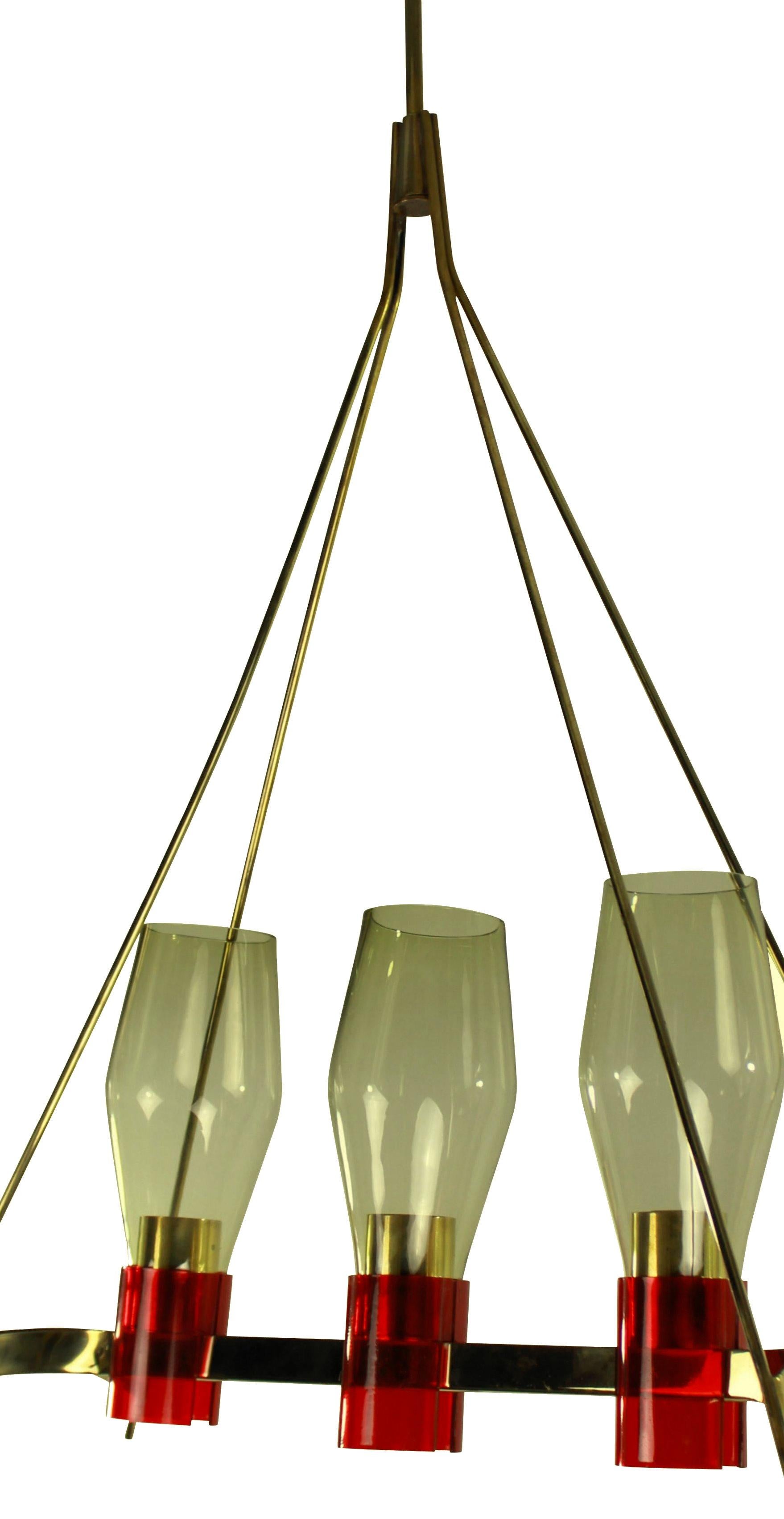 An Italian hanging light of unusual design, in brass with red detailing and pale yellow glass shades.

