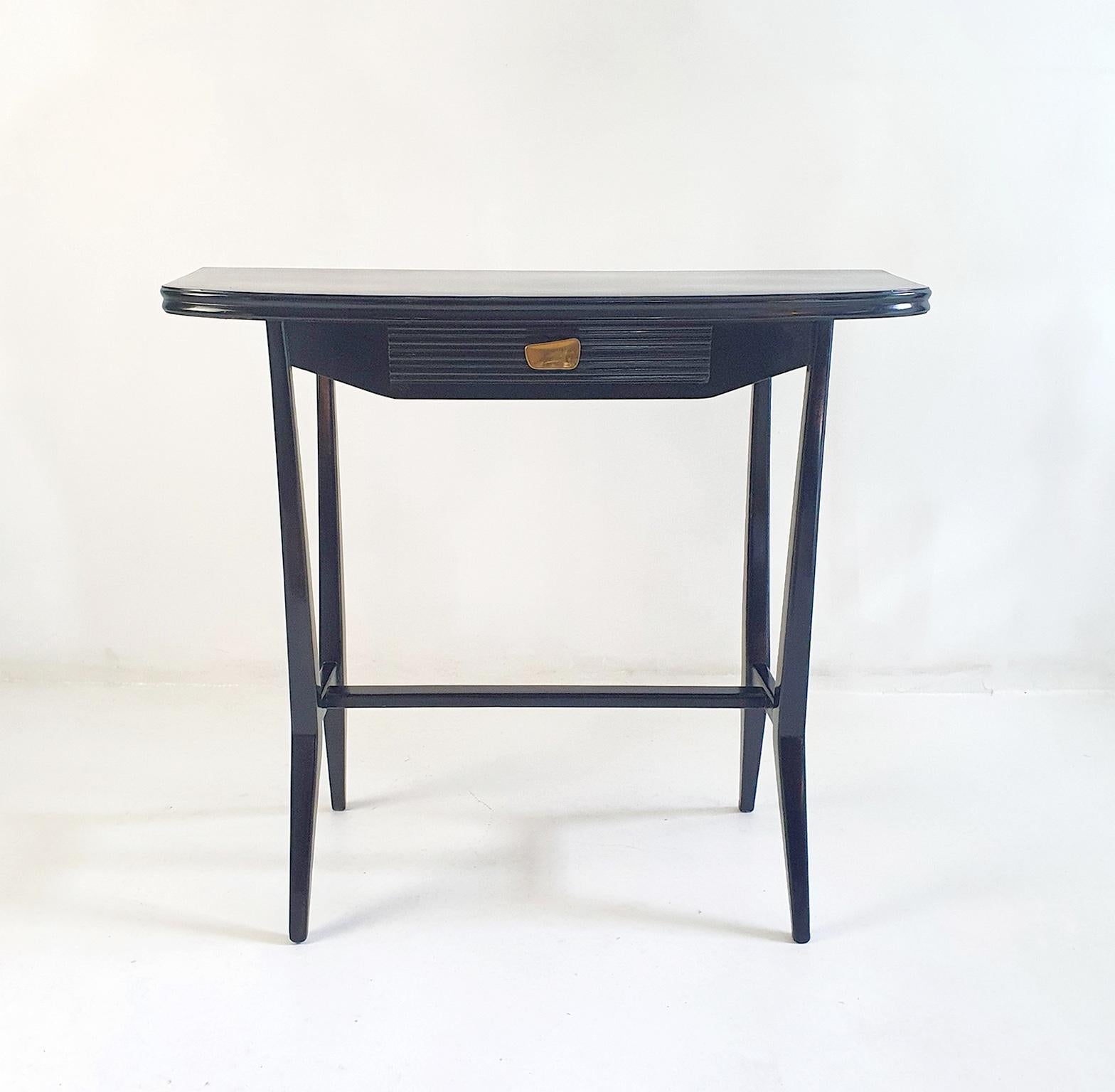 Stylish mid-century Italian console table in french polished black ash with an original designer handle in brass. This table is perfect for small and tight spaced interiors. The table has been professionally restored and polished by our restoration