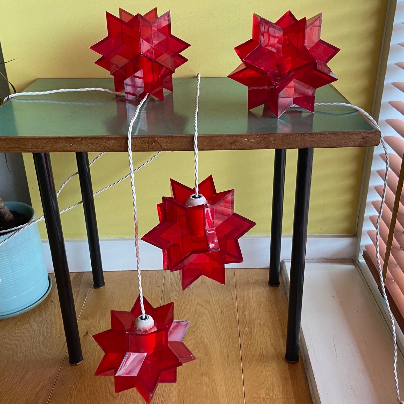 An interesting and unusual group of midcentury Italian red acrylic perspex star shaped table, floor lamps or night lights in the manner of Arredoluce. 4 available. 
priced per item. 
please note that we often have a shorter handling time than