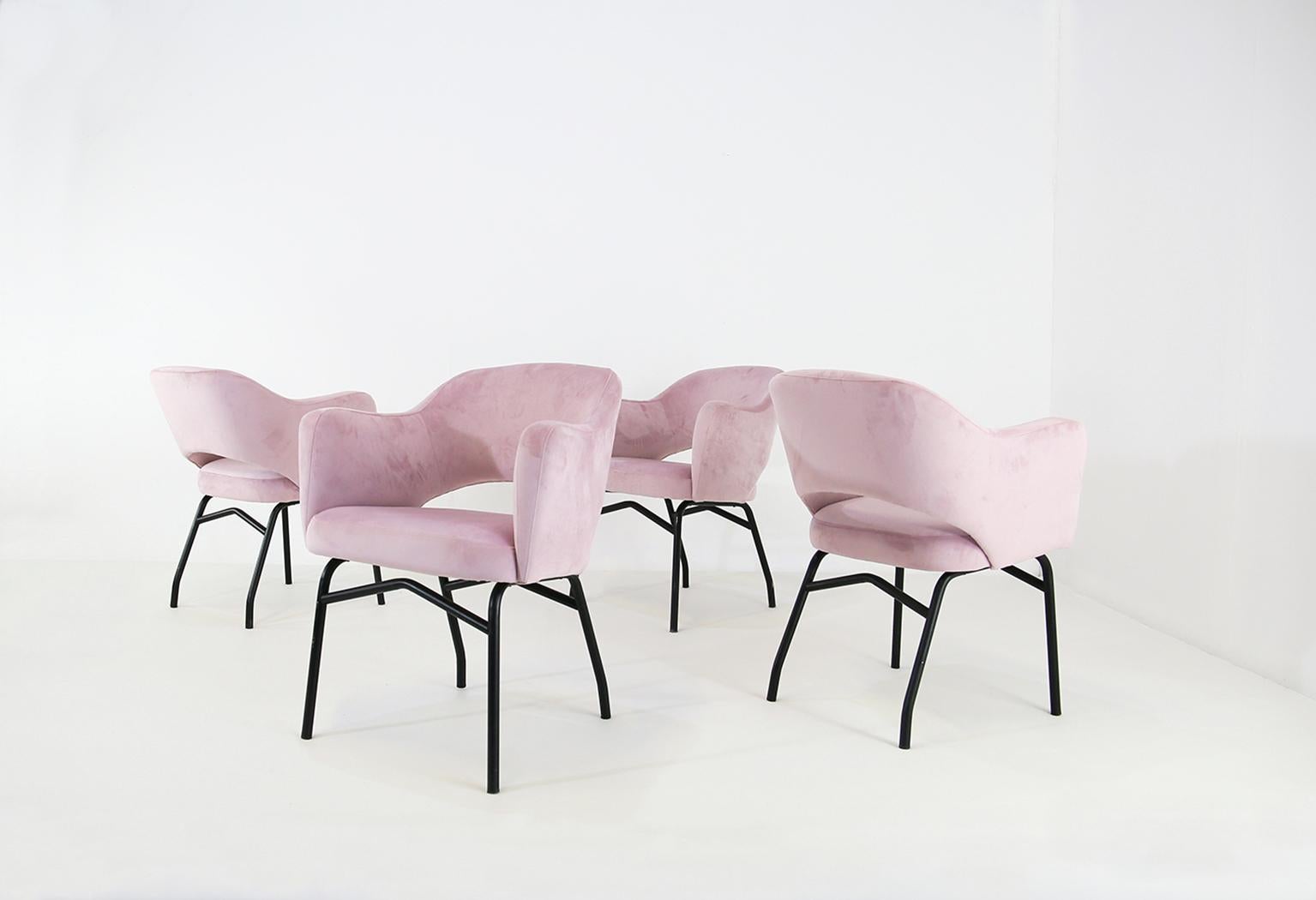 Set of 4 dining chairs made in Italy in the 1950s. The chairs have all been restored in a beautiful pink velvet. Their iron structure has also been restored and painted. The chairs are in the style of Ico Parisi. The set is ideal to complete your