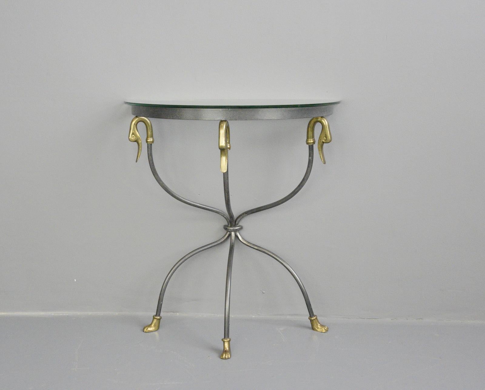 Midcentury Italian swan hallway table, circa 1950s

- Shaped wrought iron 
- Toughened glass top
- Brass feet
- Solid brass swan heads
- Italian, 1950s
- Measures: 64cm wide x 69cm tall x 32cm deep

Condition report

Cleaned and