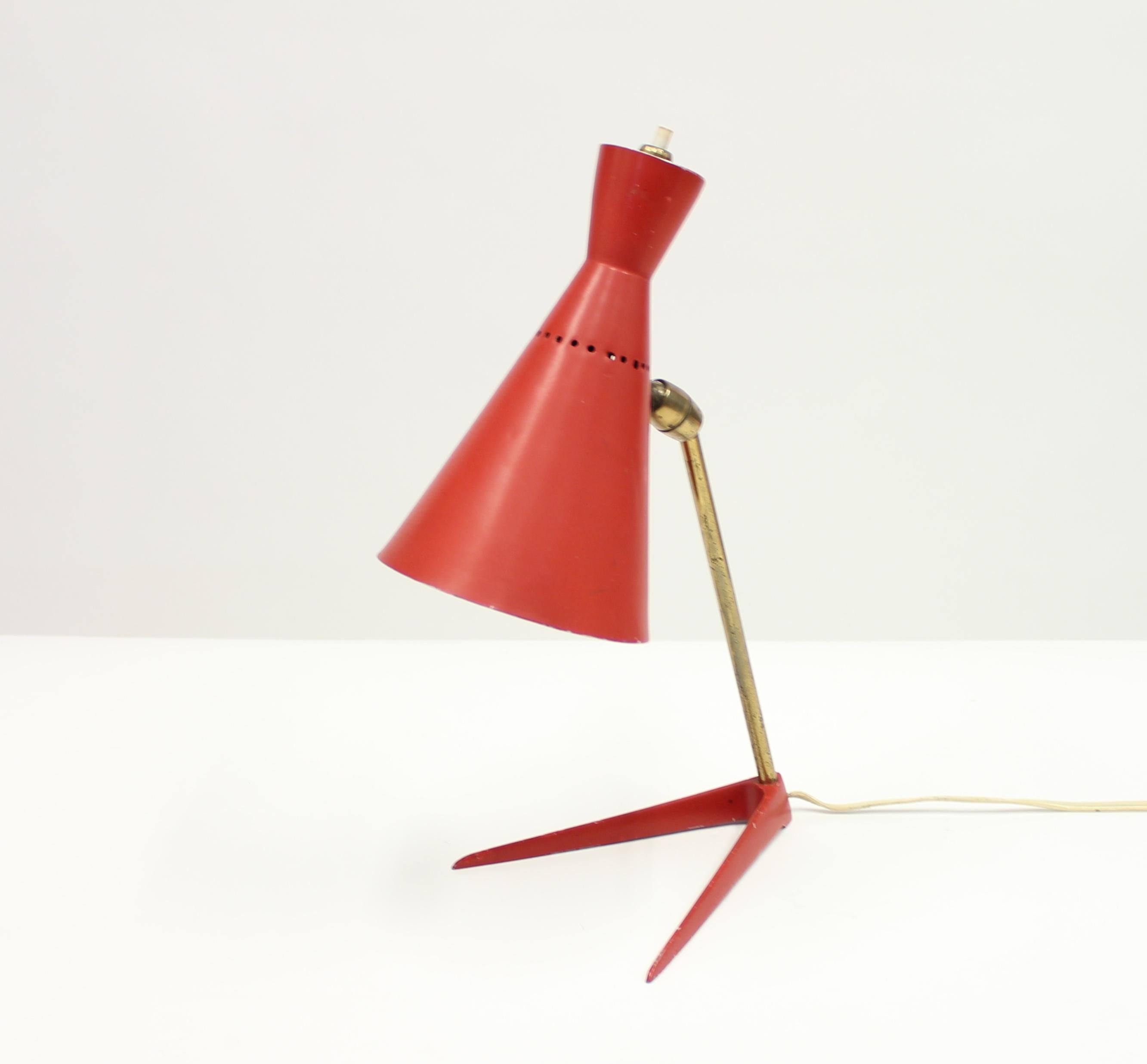 Superb 1950s Ferrari red Italian table lamp with an adjustable shade on a V-shaped base connected by a brass stem.
