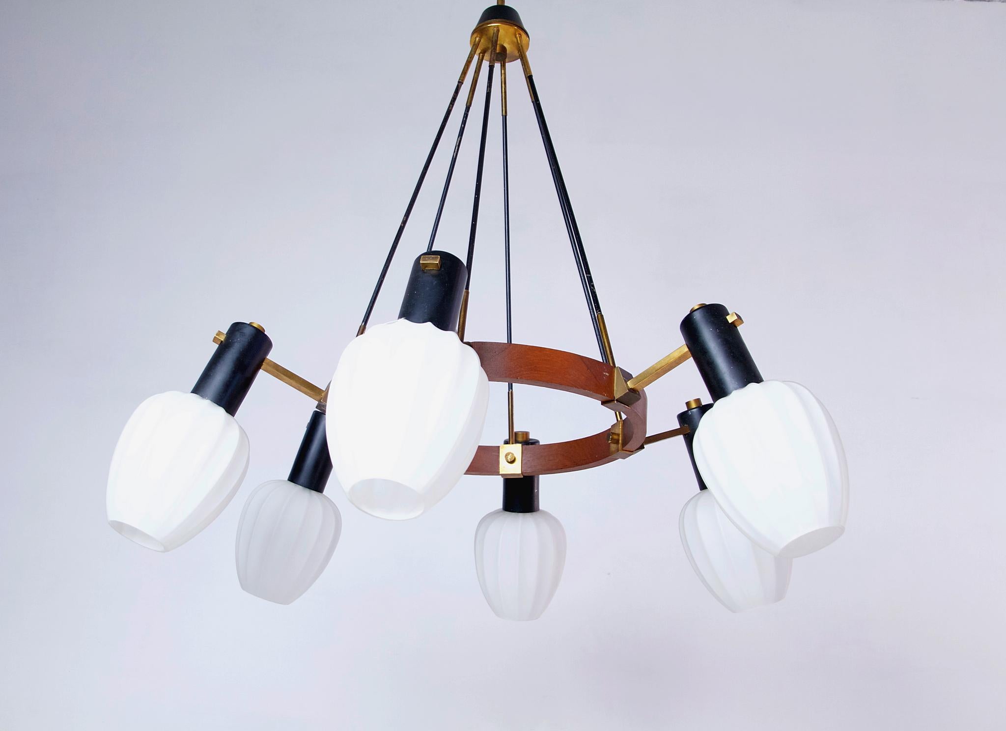Midcentury 1950s pendant with six lights fitted for E14. Original lampshades made in white opaline glass attached on black powder coated aluminium and brass sitting on a teak frame. Fully functioning and in great condition.