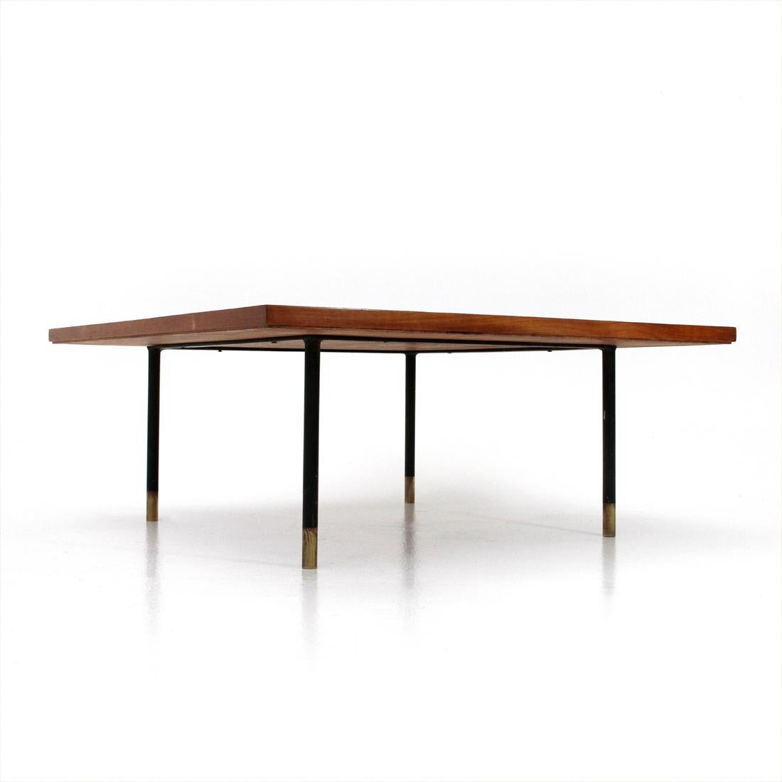 Italian manufacturing table produced in the 1950s.
Teak veneered wood top.
Black painted metal structure with brass feet.
Good general conditions, some signs due to normal use over time.

Dimensions: Width 80 cm, depth 80 cm, height 32 cm.