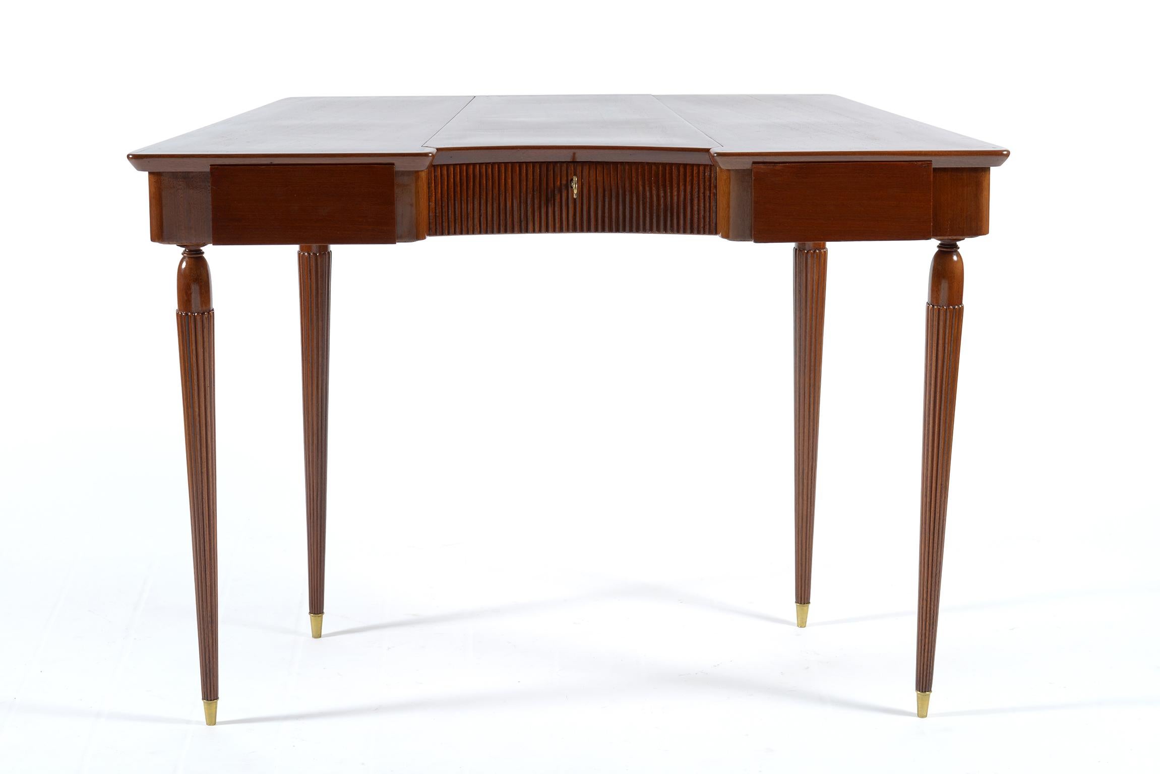 Four slender legs with brass feet and triangular top midcentury Italian desk vanity.
Walnut structure with two drawers on the sides and fluted organ cane central part that open on the top with mirror inside.
Key, feet brass details.
Florence,