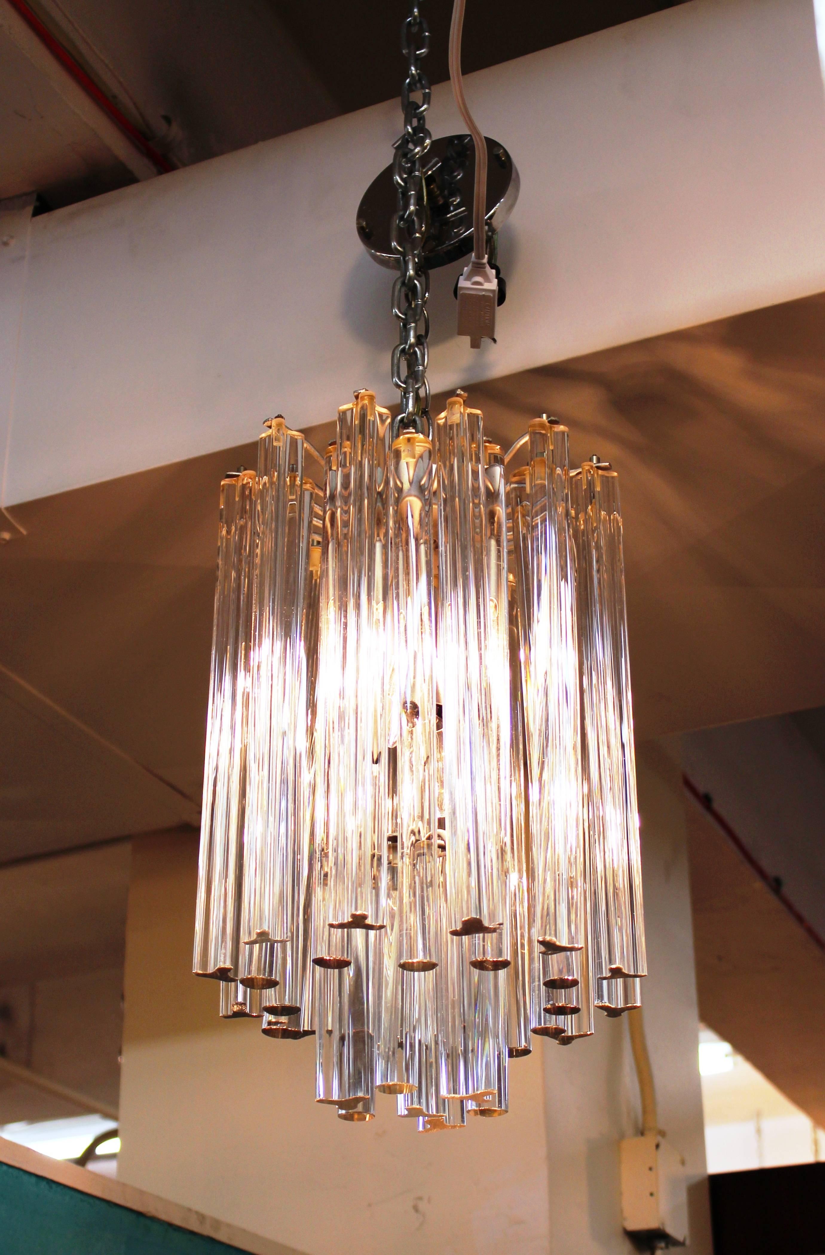 Mid-Century Modern Italian Venini Murano chrome chandelier with round and cut crystals. The piece has secure screw top attachments and has recently been rewired to fit current standards. Takes six candelabra base bulbs. In great vintage