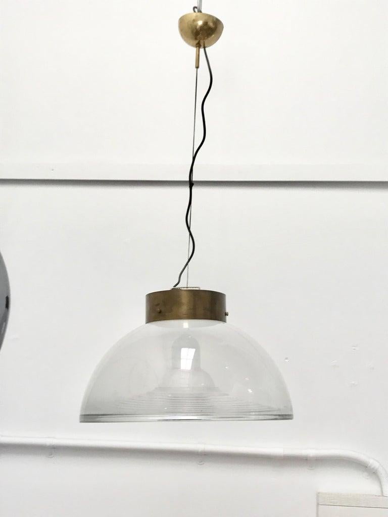 Italian Mid-Century Modern pendant in brass and Murano glass.
Very thick Murano glass and brass details made this pendant very beautiful and elegant.
This light is signed by Vetri Murano and has the original sticker on the glass.
Very good condition.