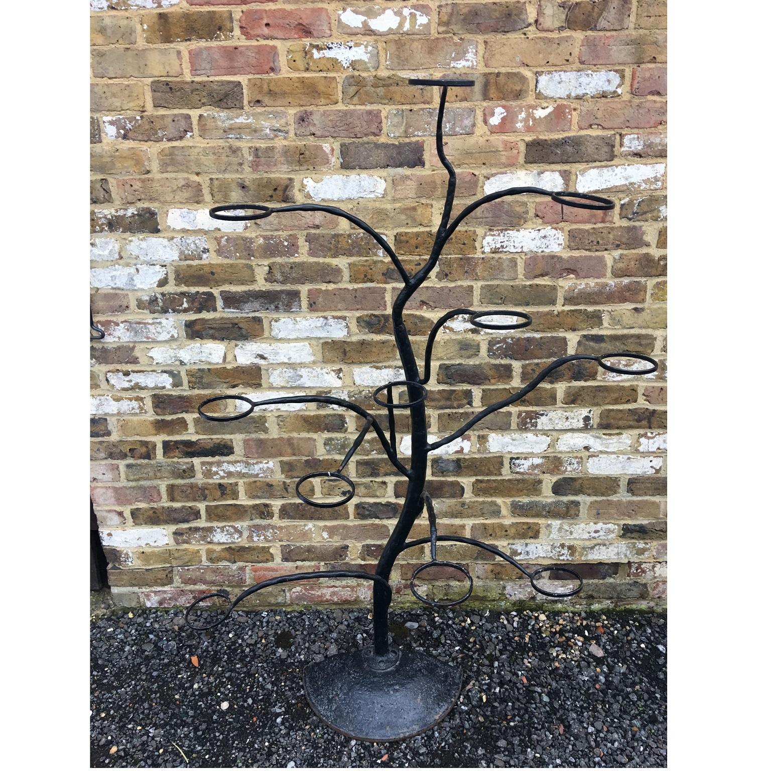 Midcentury Italian wrought iron sculptural tree planter, circa 1950

Midcentury Italian wrought iron sculptural tree plant pot holder. Beautifully sculptured in the shape of a climbing tree, with 11 individual pot holders. Each pot holder is 11 Cms