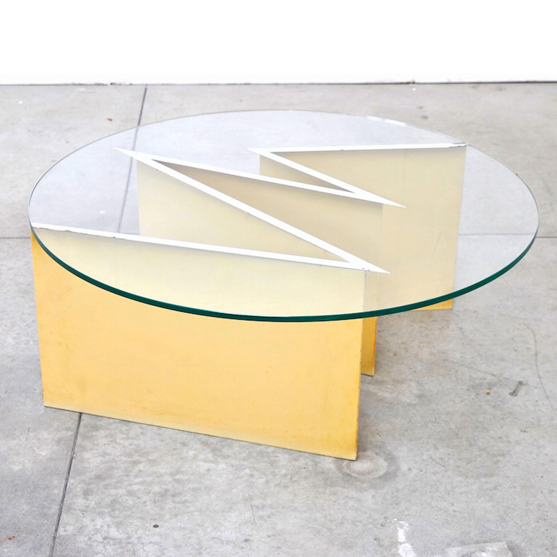 Midcentury Italian coffee table by Giuseppe Raimondi for Cristal Art mod 3101 Zeus iron base and a circular top in glass, 1960s. The glass was made in order to follow the shape of the base.