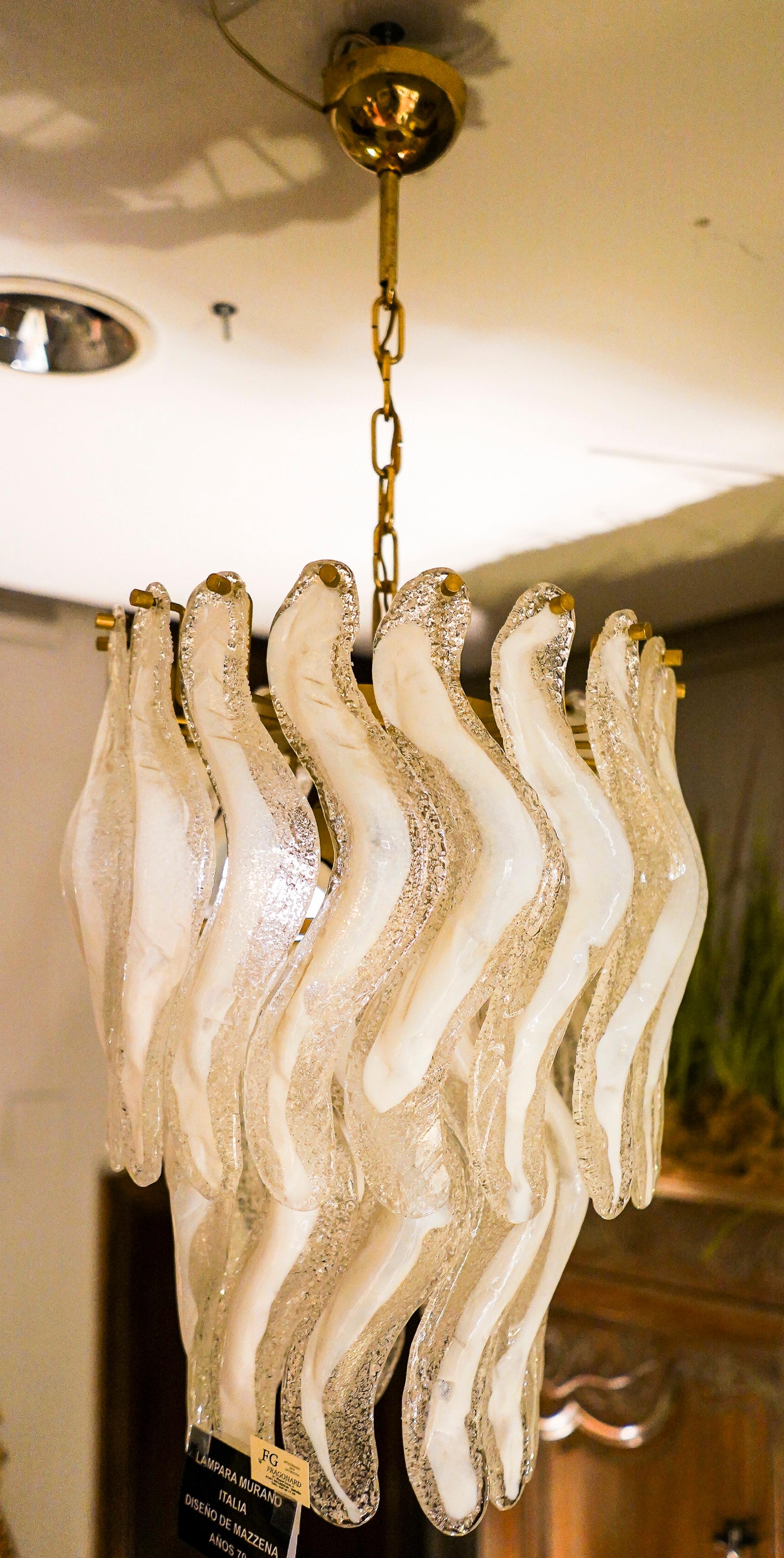 Exquisite 1970s, Italy Murano white crystal chandelier by Mazzena with frozen effect. In a perfect condition. Beautiful don't matter where its placed, unique. Its a touch of  exquisite freshness anywhere
The price includes a special wooden box or